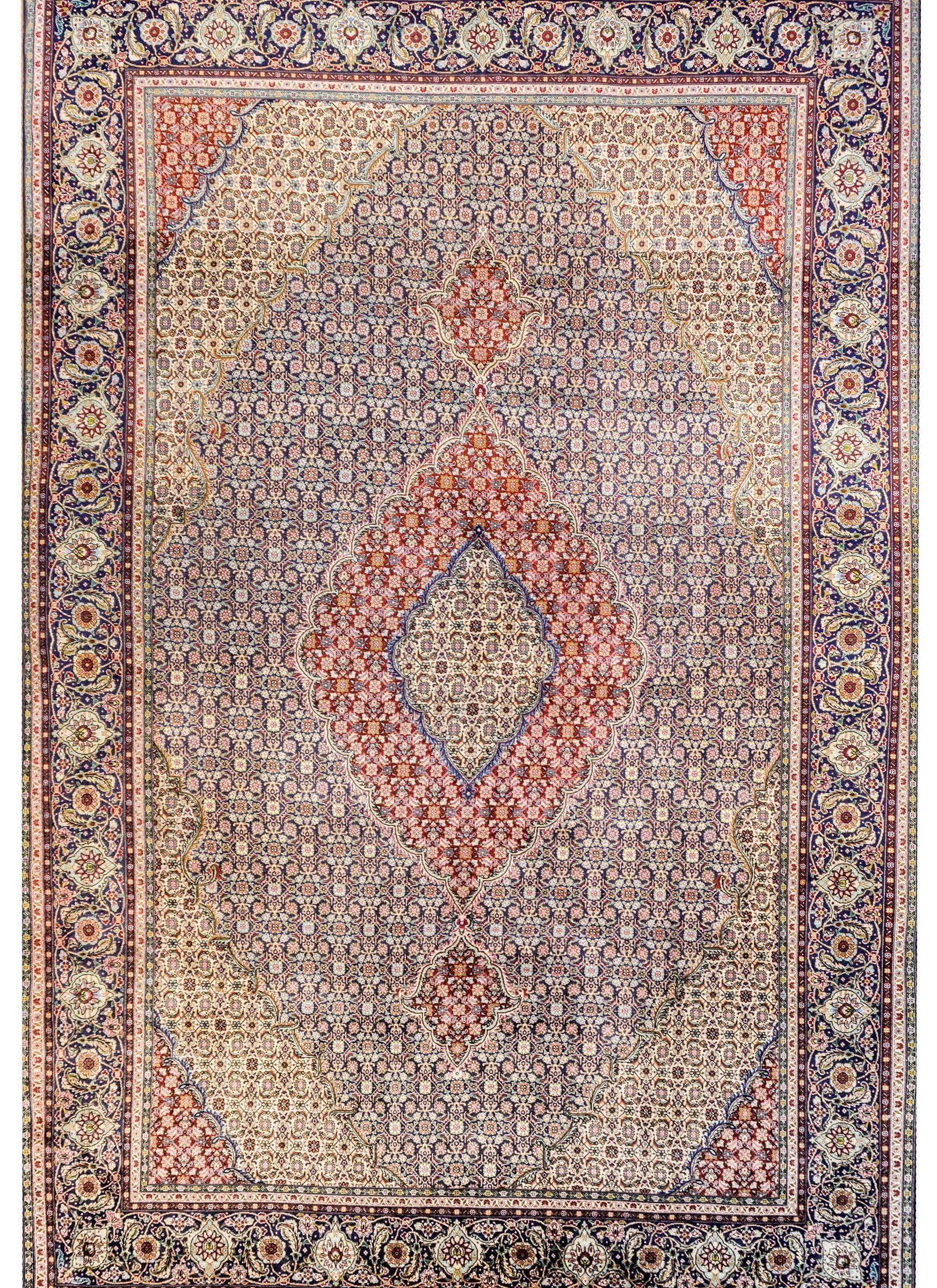A gorgeous Persian Tabriz rug with a densely woven trellis 