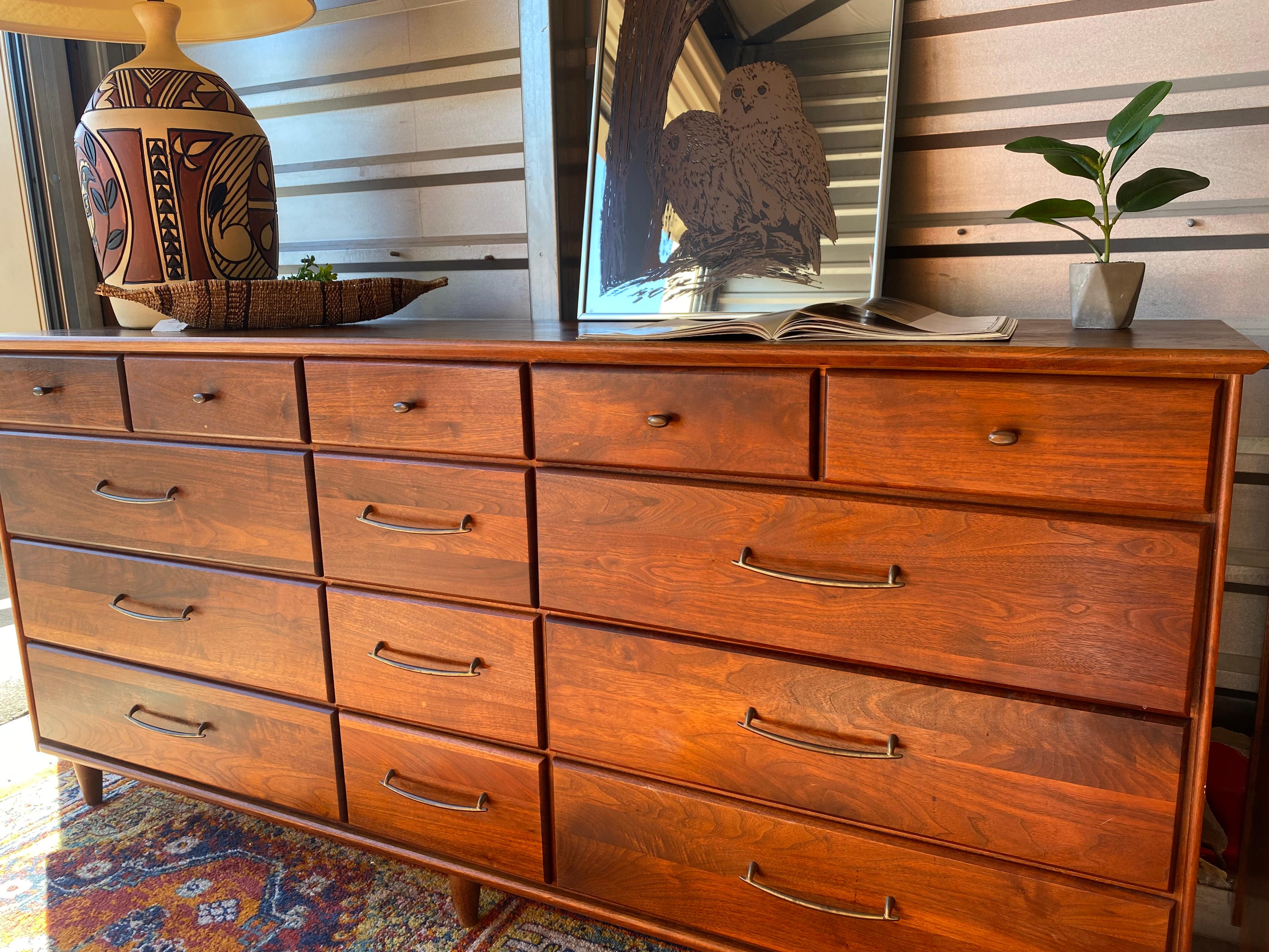 Beautiful 12 drawer dresser piece. Smooth sliding drawers. Gorgeous wood grain pattern. Such a statement piece!.