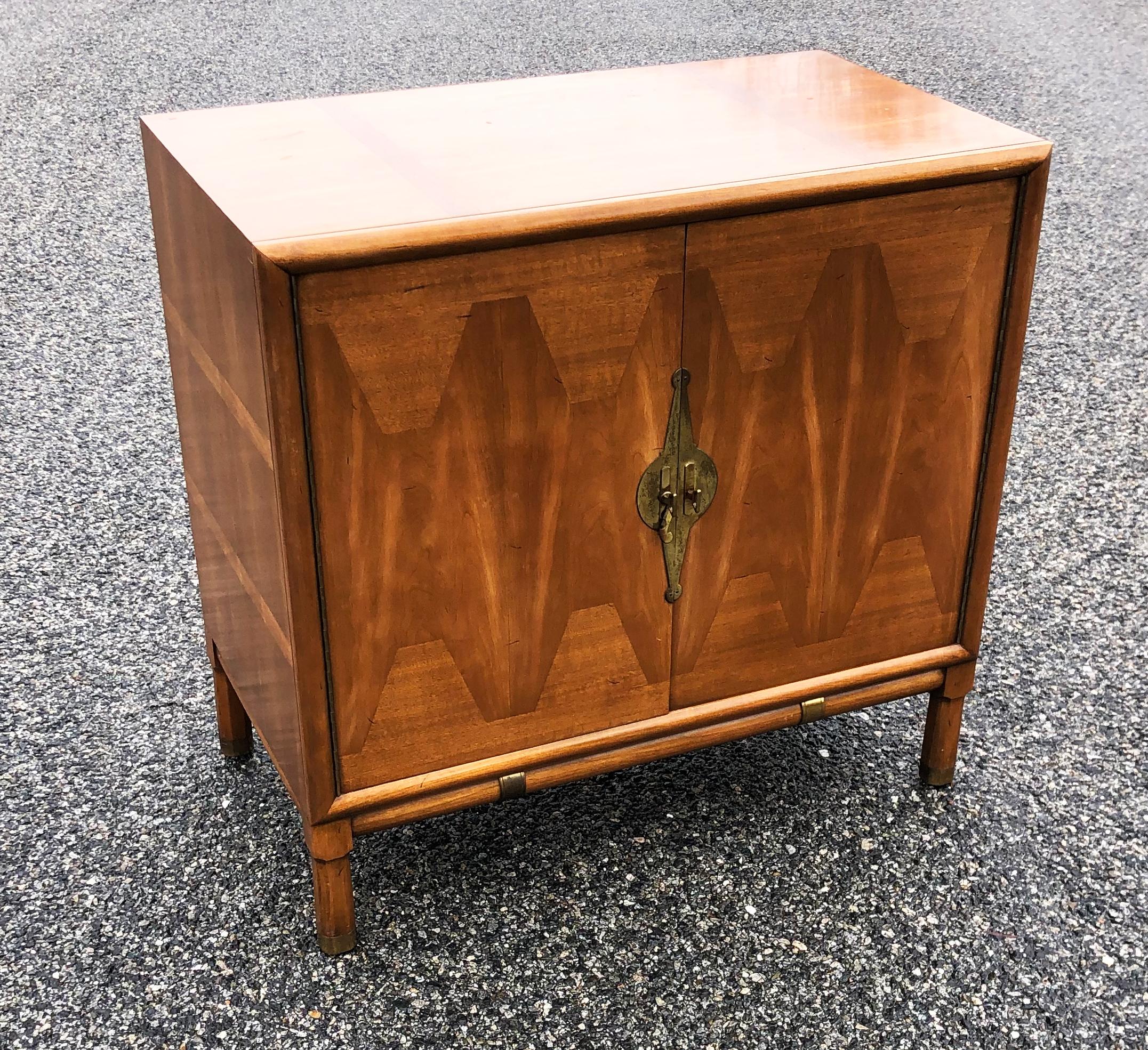 This incredible midcentury Classic is a true work of art the marquetry is exquisite the Chinese inspired brass lock and details are gorgeous and every aspect of this piece of furniture is incredible. Though I am attributing this cabinet to Renzo