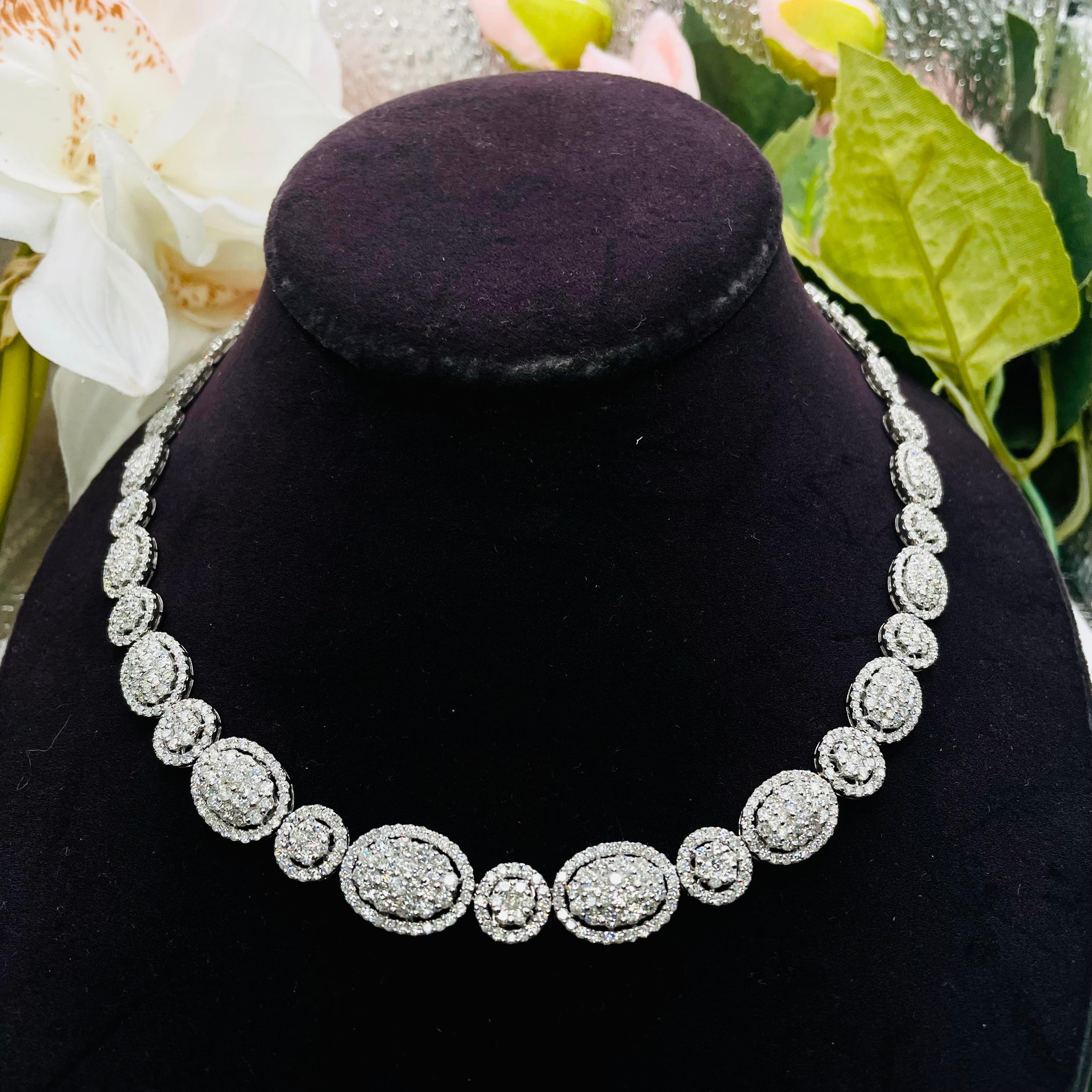 Crafted from 18k white gold,weighing 32.78 grams this necklace boasts a brilliant shine that perfectly complements the dazzling diamonds that adorn it. The total carat weight of the diamonds is an impressive 15.11 TCW, ensuring that this necklace