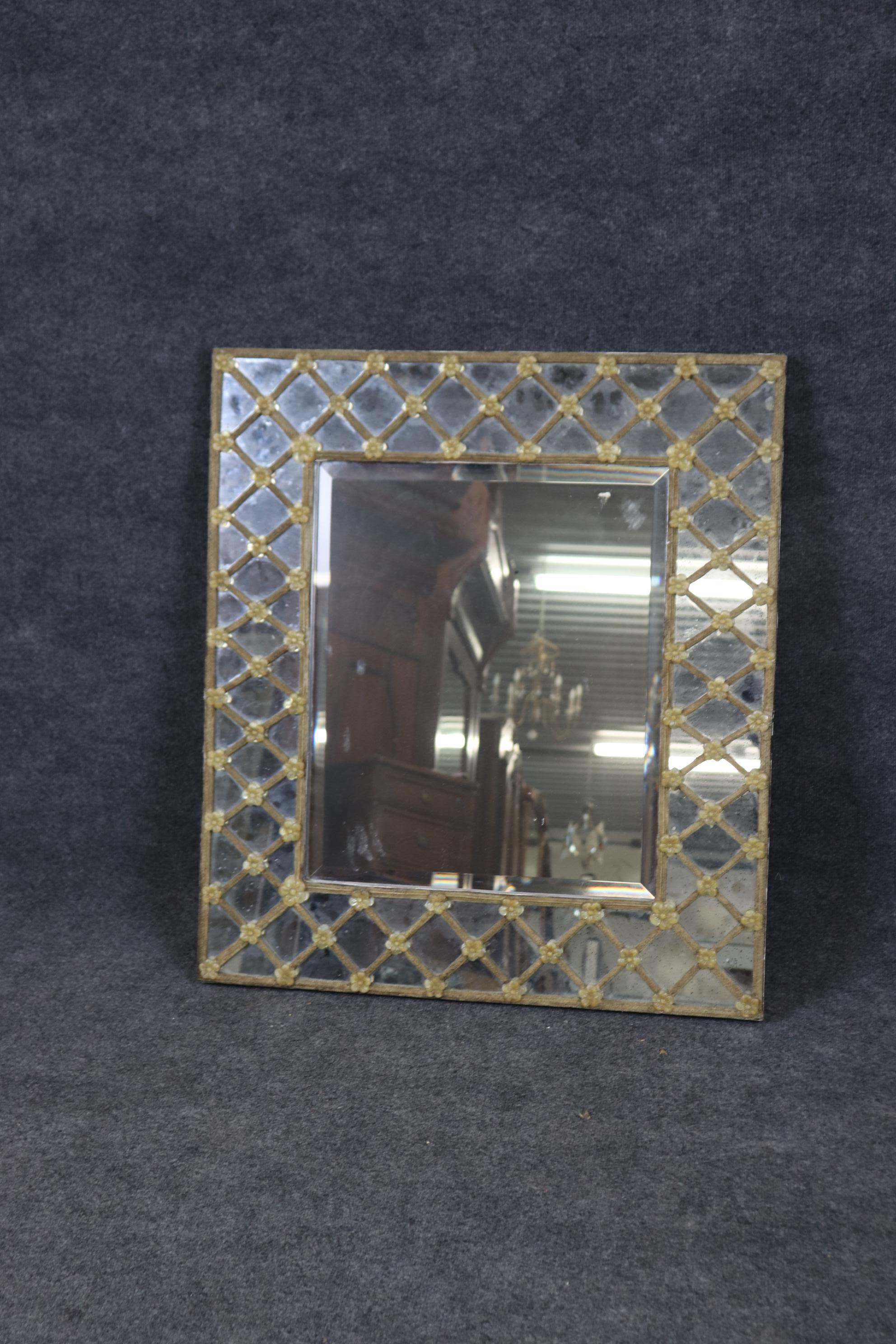 This is a beautiful mirror that can be hung vertically or horizontally. The mirror has that Murano glass candy-cane stripes and flowers and a beveled plate mirror. The mirror dates to the 1960s and is dirty but will clean up like new. 

Measures