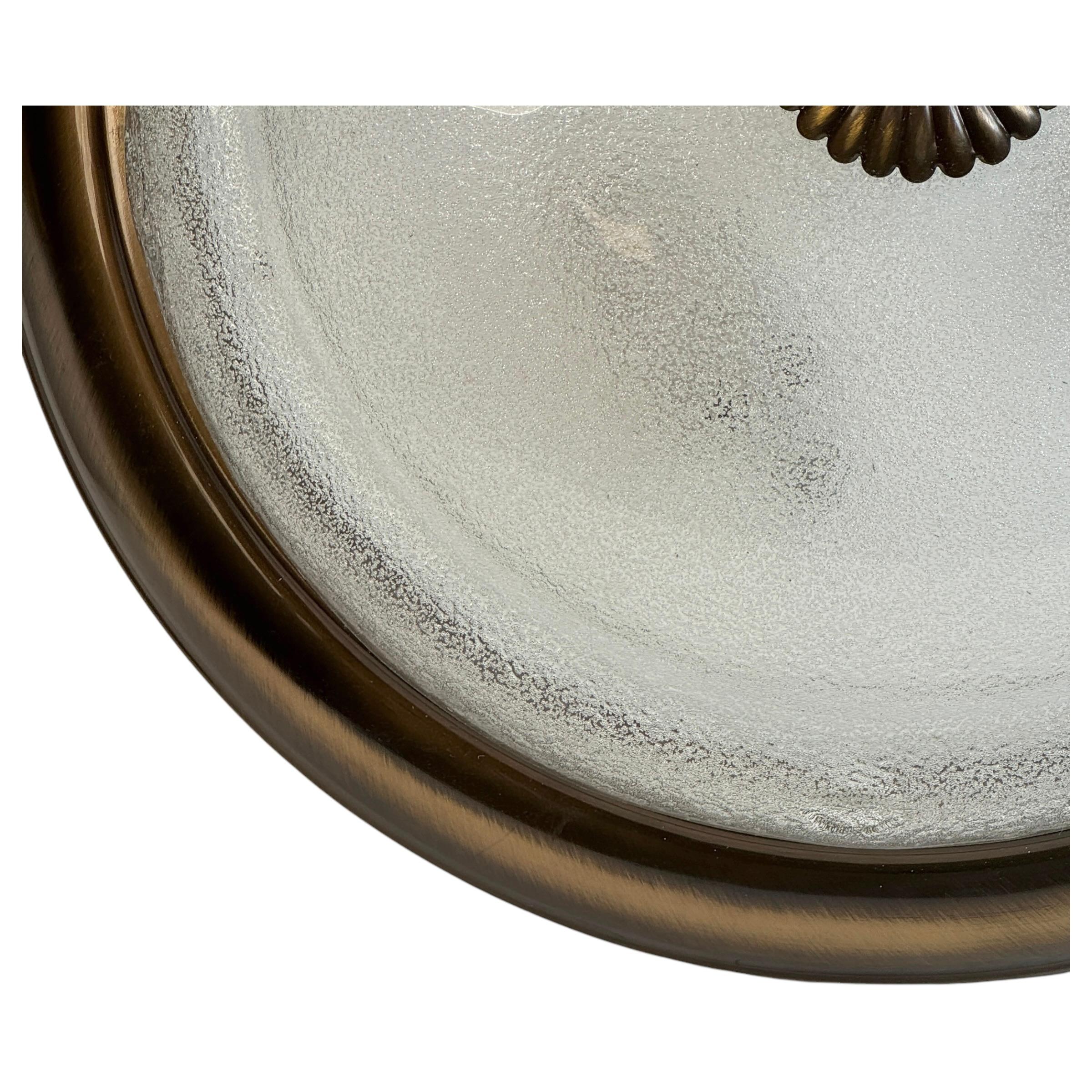 A beautiful flush mount light made in Austria by Orion Lighting Company. It is made of a metal frame with a murano glass shade. The fixture requires three European E27 / 110 Volt Edison bulbs, up to 60 watts each socket. A nice addition to any room.