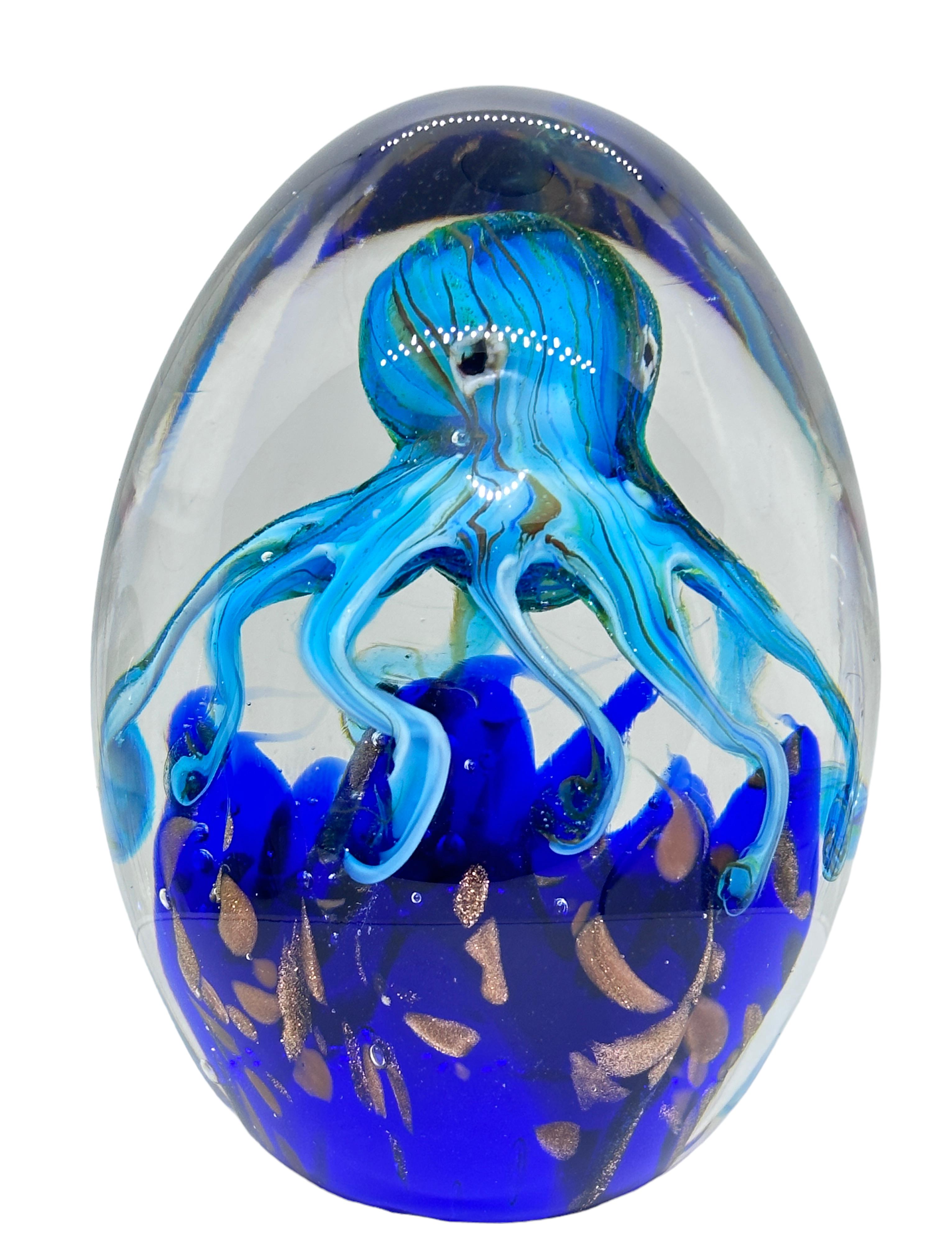 Beautiful Murano hand blown aquarium Italian art glass paper weight. Showing a giant octopus, in a glass bubble floating on controlled bubbles. Colors are a blue, yellow, gold and clear. A beautiful nice addition to your desktop or as a decorative