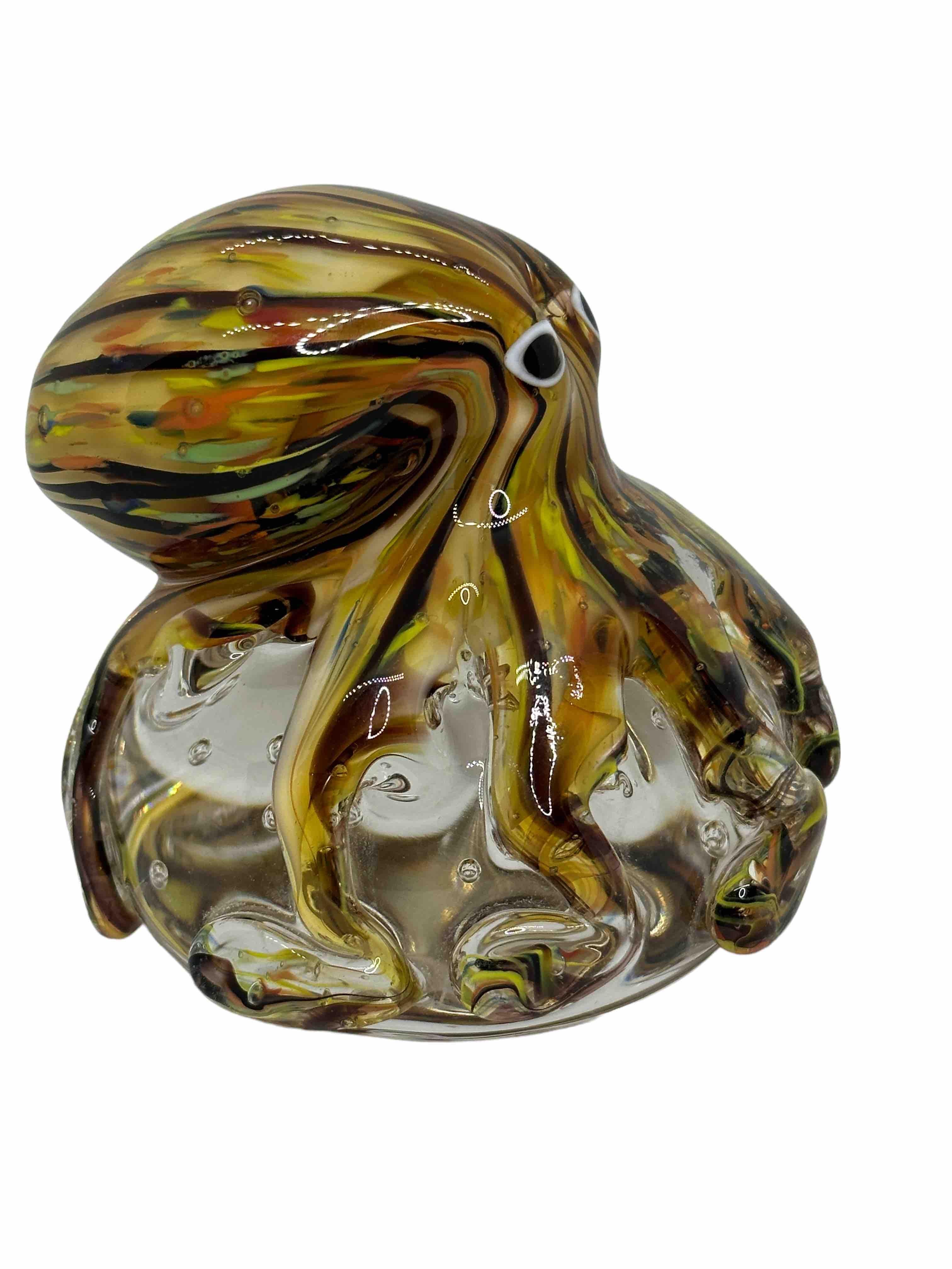 Beautiful Murano hand blown aquarium Italian art glass paper weight. Showing a giant octopuses, on a glass bubble floating on controlled bubbles. Colors are a blue, yellow, orange and clear. A beautiful nice addition to your desktop or as a