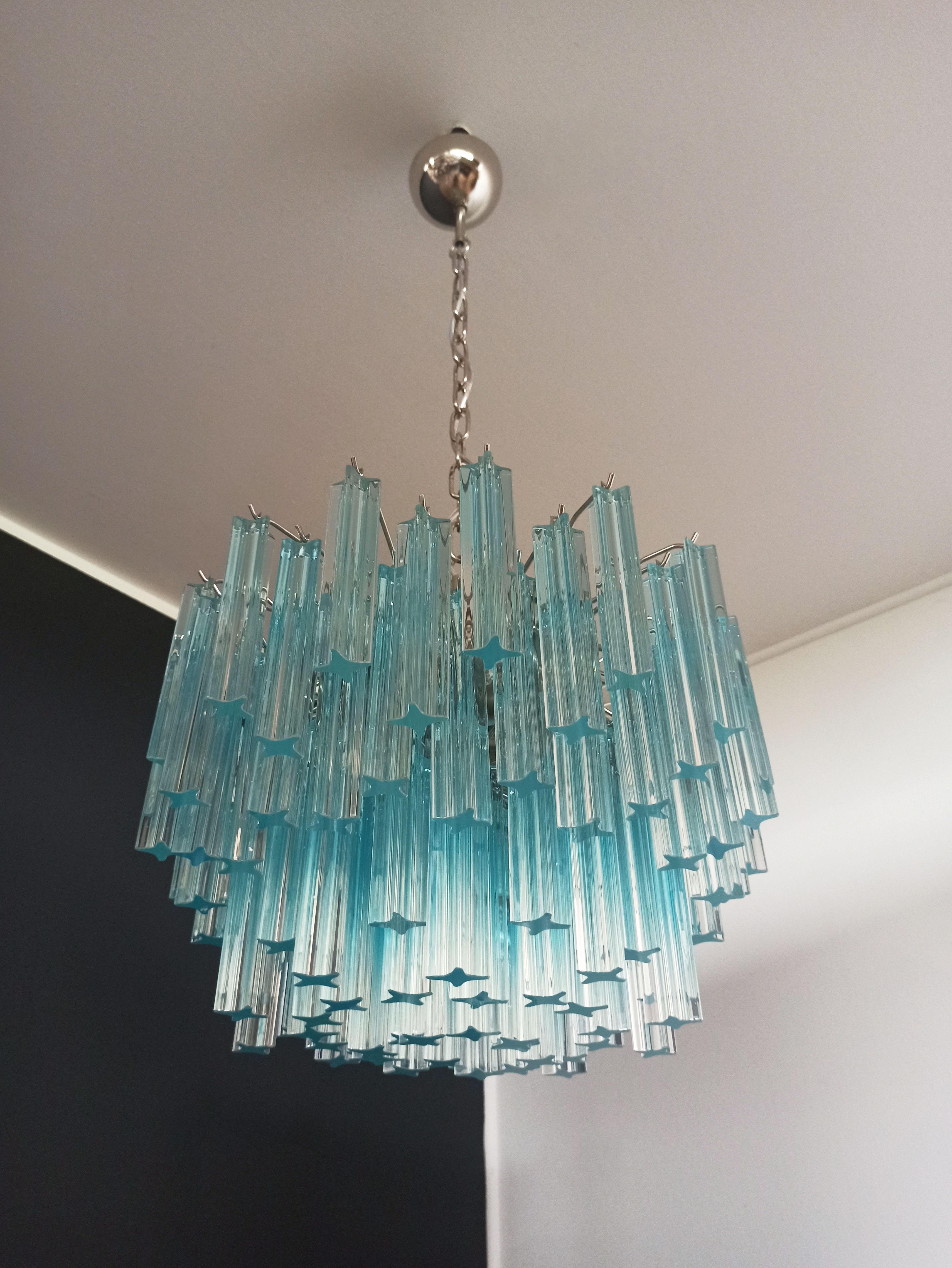 Fantastic vintage Murano chandelier made by 107 Murano crystal prism quadriedri in a nickel metal frame. The glasses: quadriedri blue shade
Period: 1980s
Dimensions: 45.25 inches height (115 cm) with chain, 15.75 inches height (40 cm) without