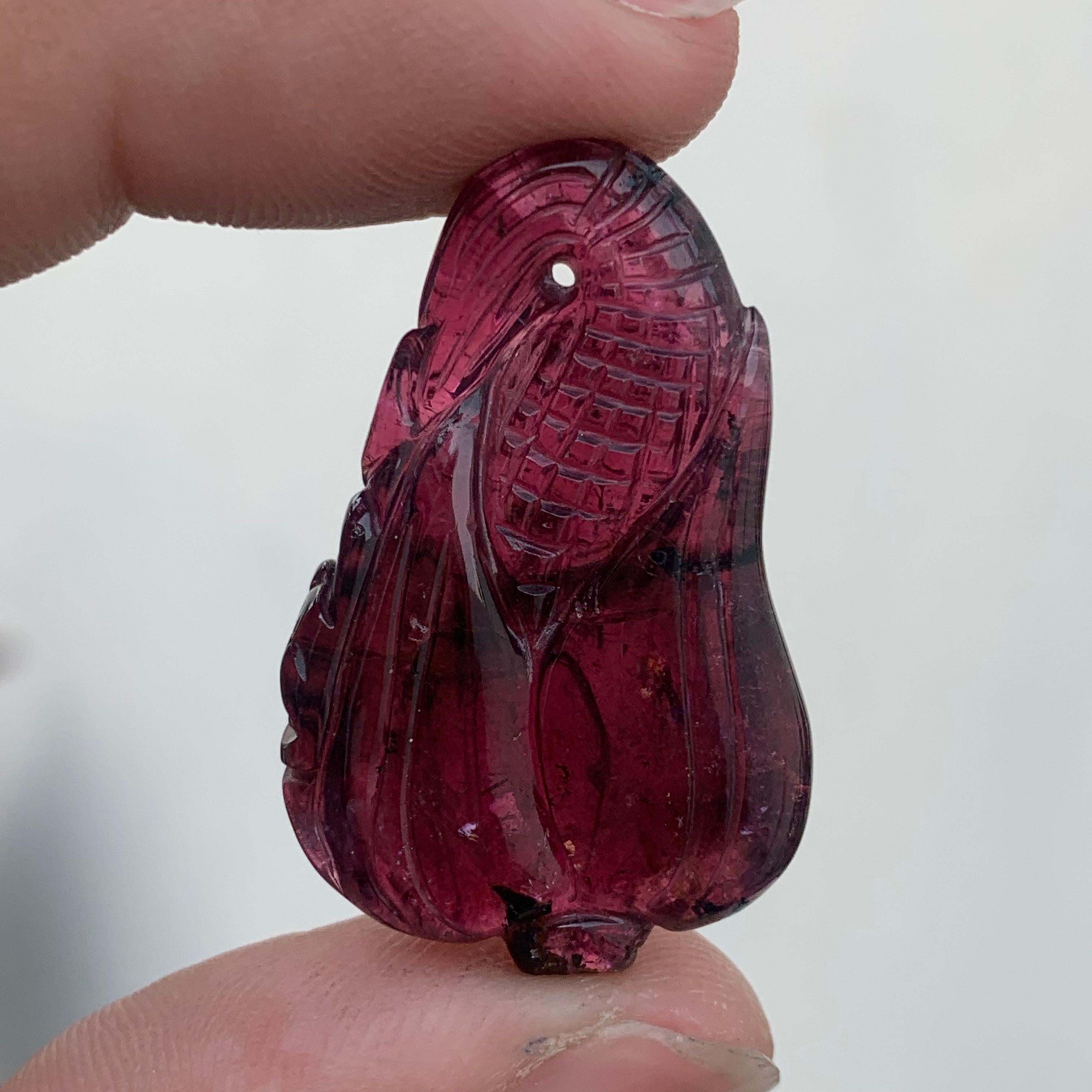 Tourmaline Carved
Weight: 37 Carats
Dimension: 34x21x7 Mm
Origin: Africa
Color: Red 
Shape: Carving
Quality: Top
.
Bicolor tourmaline is connected to the heart chakra, which makes it good for cleansing and removing any blockages. The stone restores