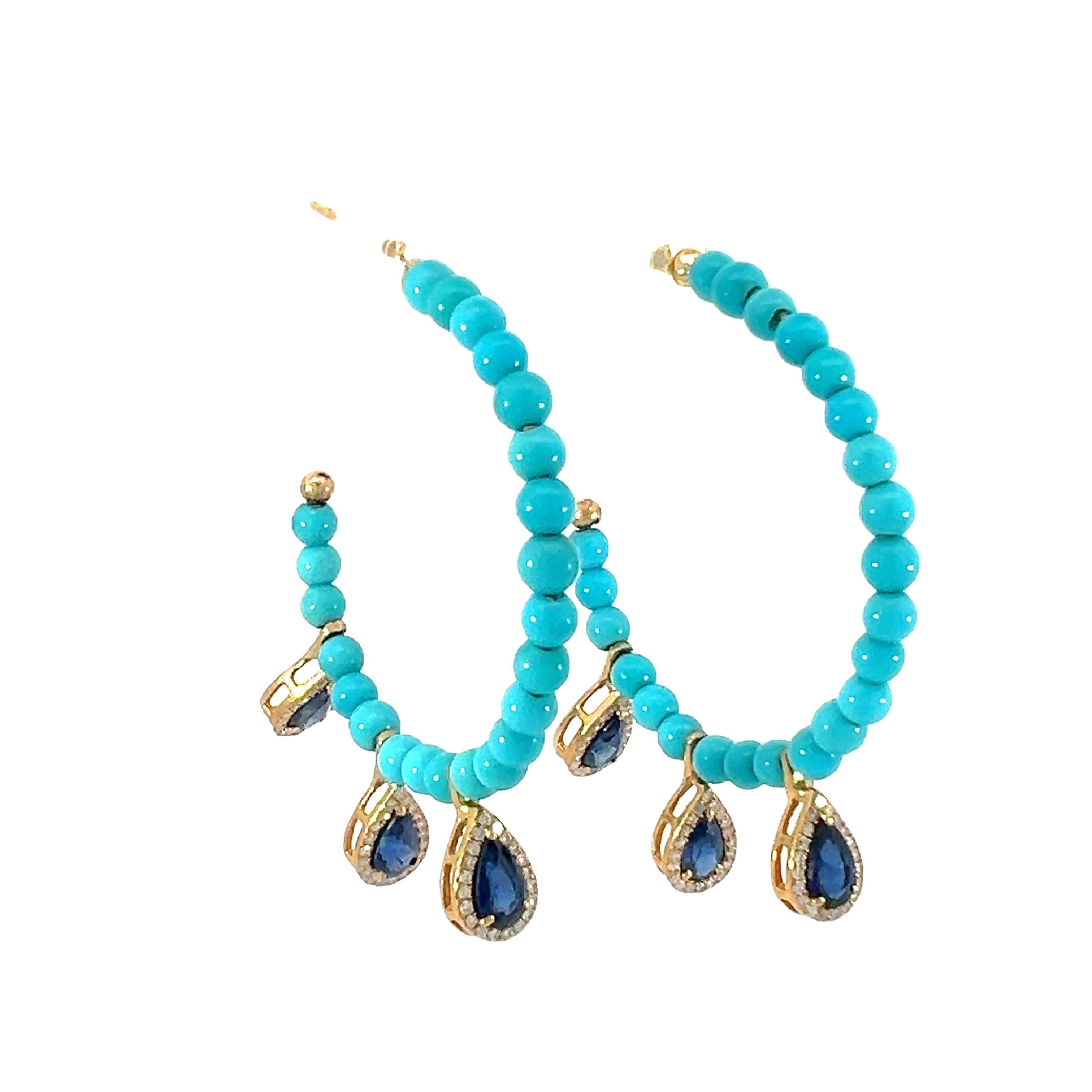 Gorgeous natural 7.60-carat turquoise, 1.54-carat sapphire, and 0.30-carat diamond hoop earrings. The blue sapphire is surrounded beautifully by diamonds in the shape of a pear. 

These sophisticated turquoise hoop earrings are the ideal statement