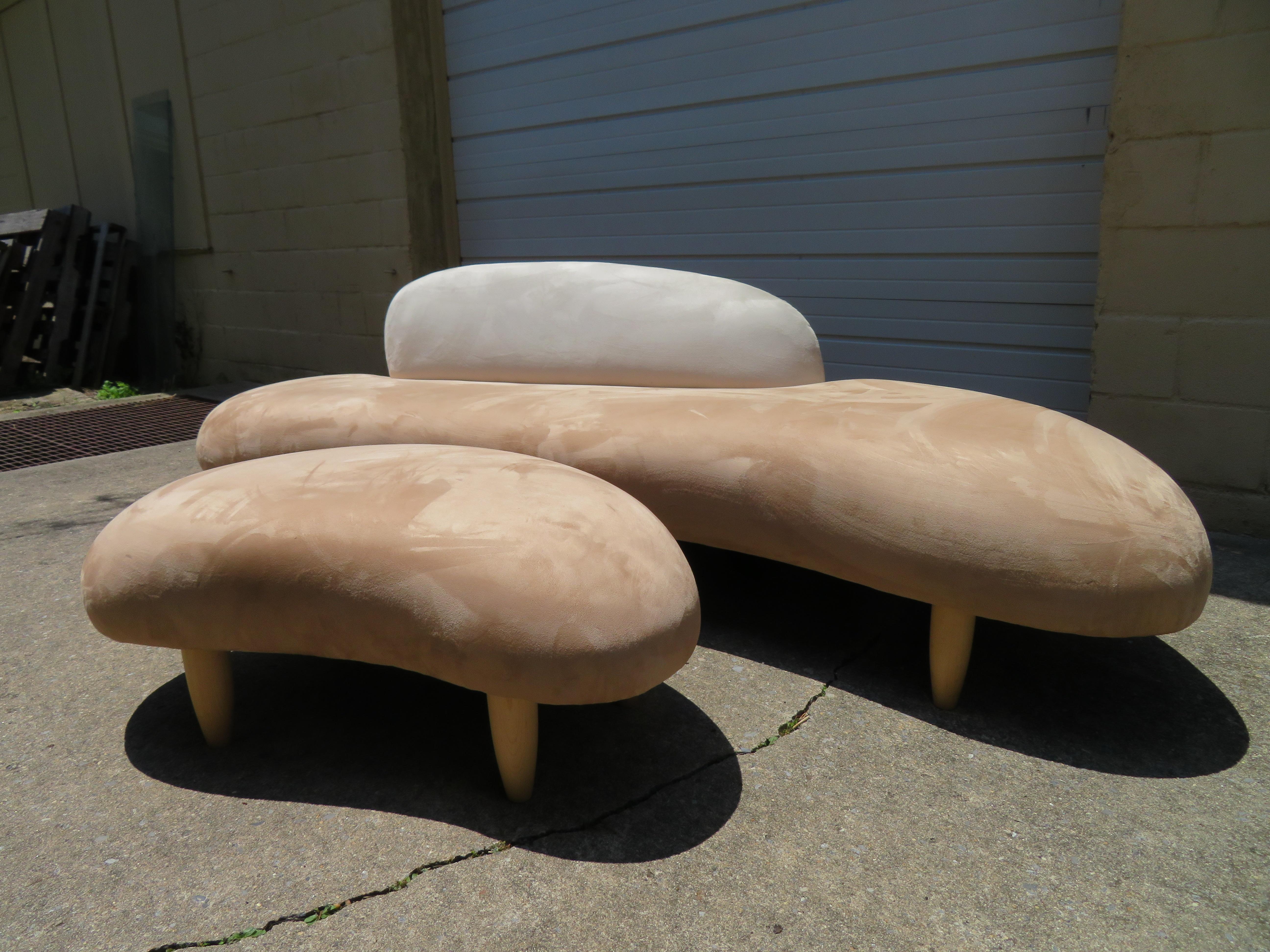 Gorgeous Noguchi style freeform cloud sofa and ottoman. This sofa set is a vintage reproduction of the original from the 1990s. The sculptural quality of Noguchi's design vocabulary finds expression in the free-form sofa: it is entirely different