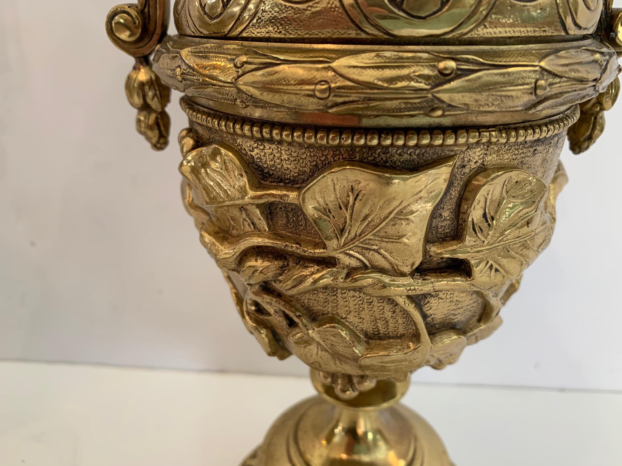 French Gorgeous Ornate Pair of Revival Style Cast Brass Relief Lidded Urns For Sale