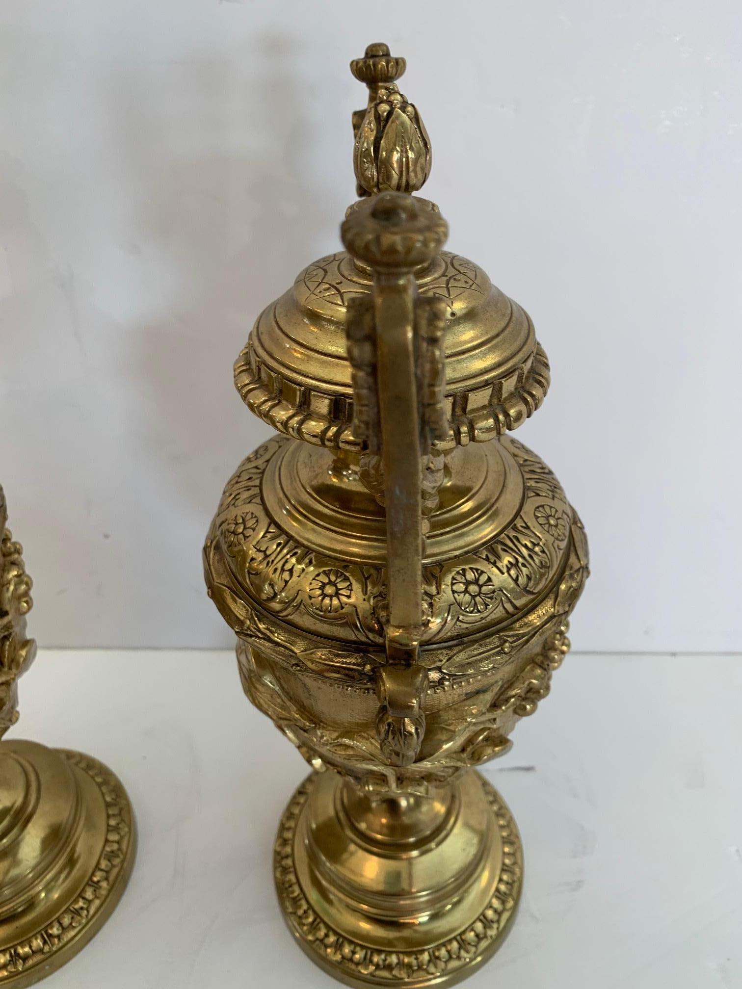 Bronze Gorgeous Ornate Pair of Revival Style Cast Brass Relief Lidded Urns For Sale