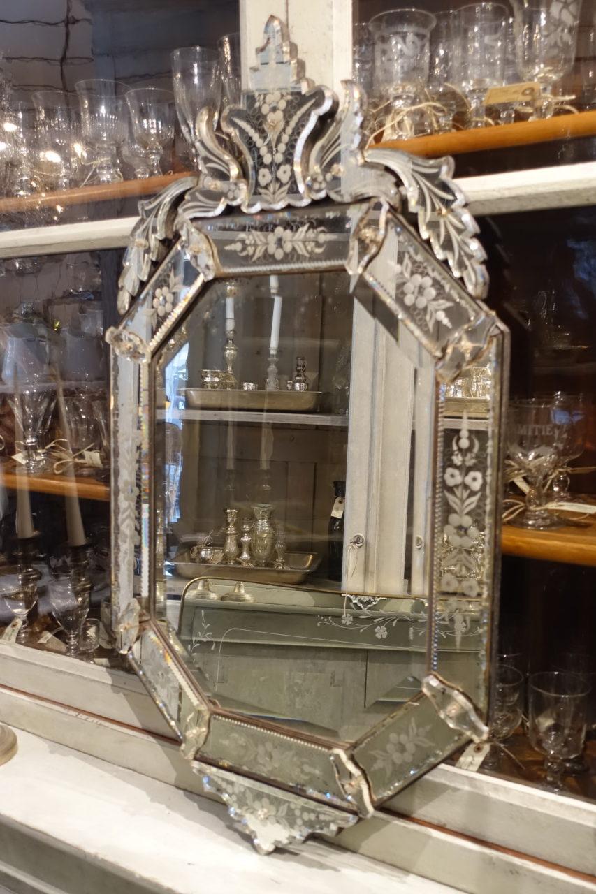 Gorgeous vintage Venetian mirror, from circae 1920s-1940s France. Beautiful faceted mirror glass, and lovely decorative ornamental work. Note the fabulous ornate top.
