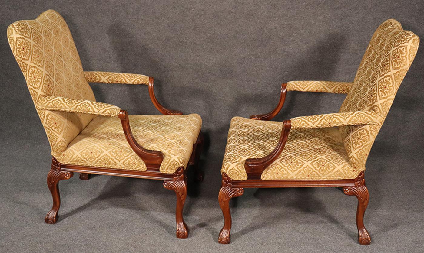 These is a very attractive pair of Georgian style armchairs. The chairs are in good structural condition, and show minimal wear. 

Dimensions: H 37 3/4in, W 28in, D 30 1/2in 

Seat height 16 1/2in.