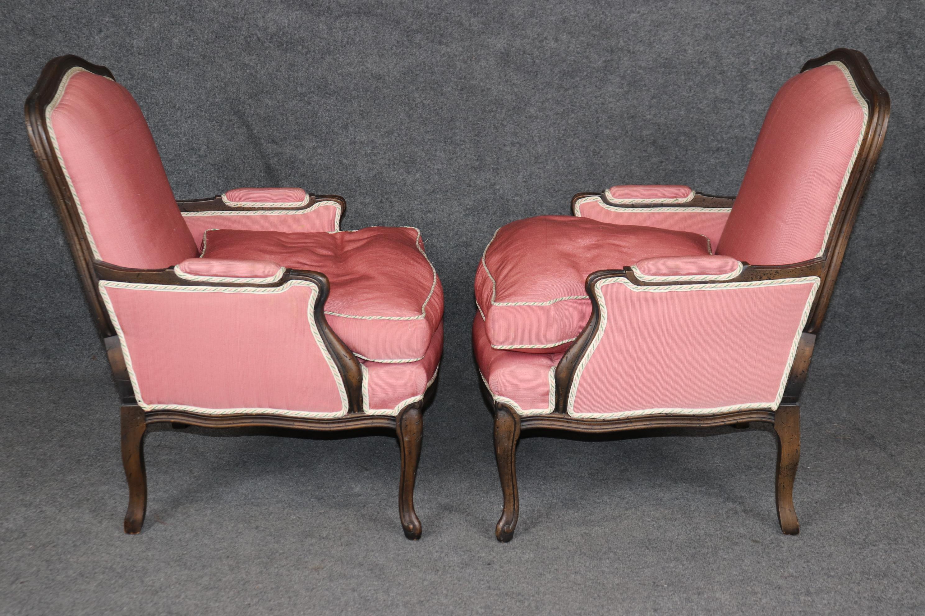 Late 20th Century Gorgeous Pair Carved Walnut Louis XV Style Bergères with Pink Off-White Fabric