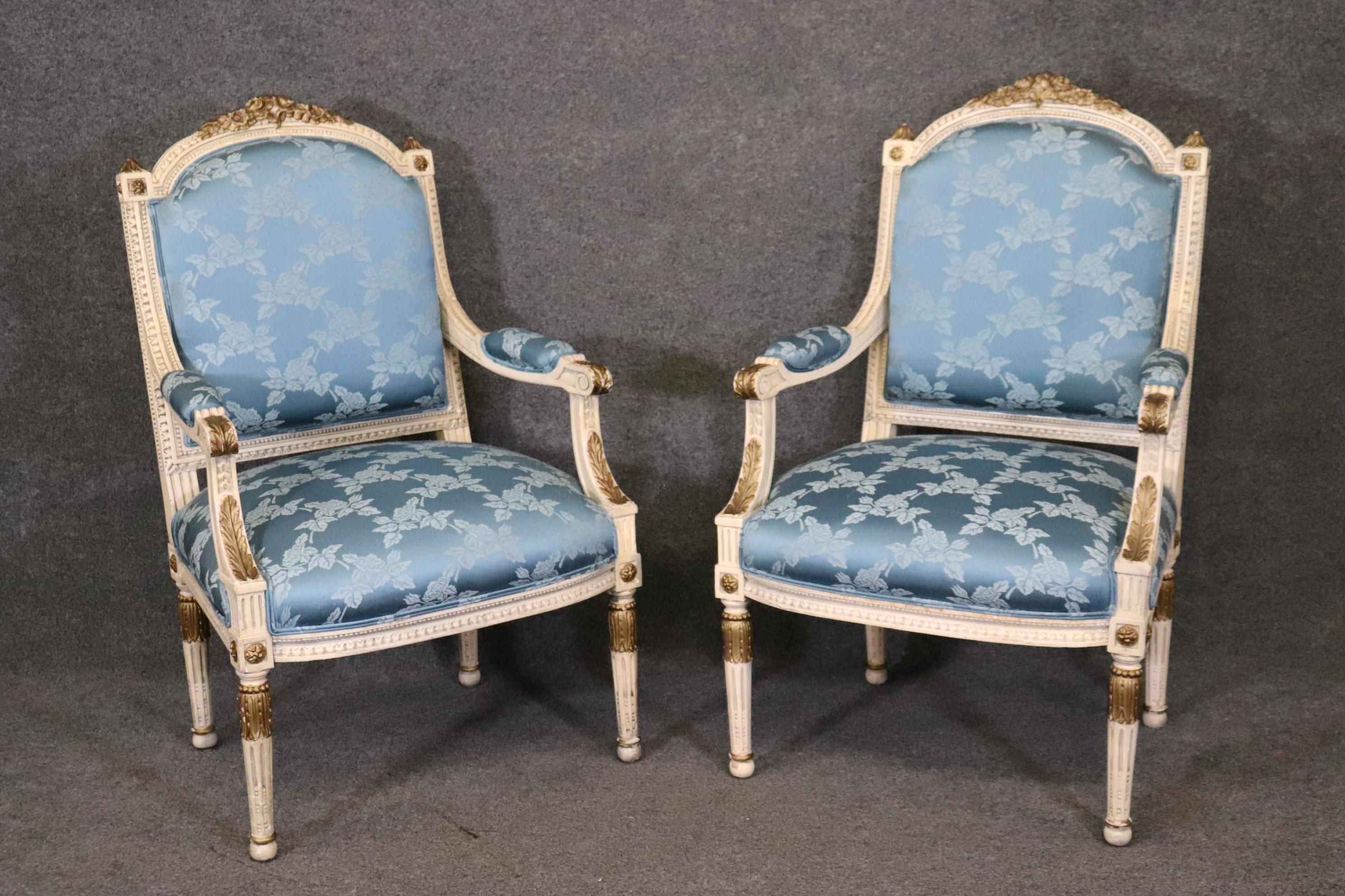 This is one of two pairs we have. They are in good condition and may have signs of wear and use including minor stains here or there but nothing significant or unusual for a pair of 70-80 year old chairs. The carving and painted and gilded finishes