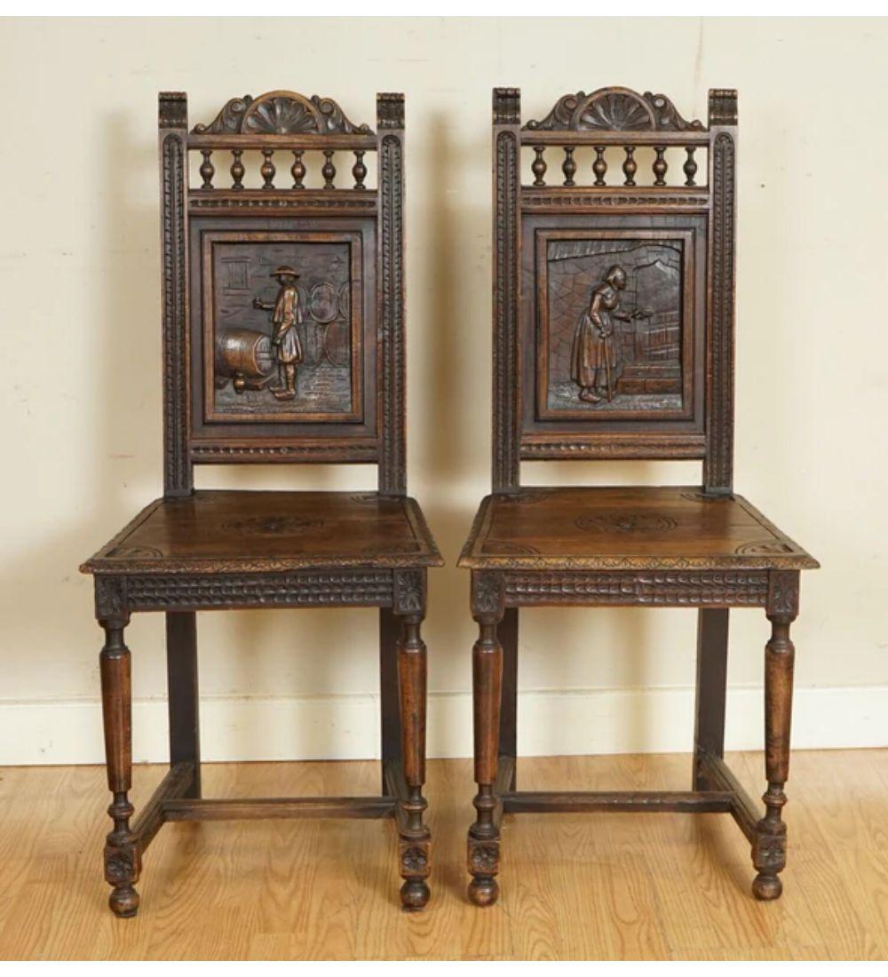 We are delighted to offer for sale these Beautiful Antique Circa 1920s Hand Carved Oak Chairs.

A very well-made and solid pair, they have charming carvings, and their age makes them such stunning pieces.

We have lightly cleaned it from top to