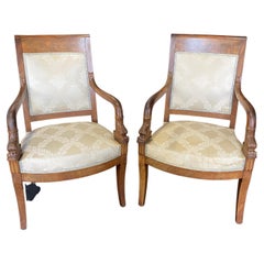 Gorgeous Pair of French Empire Carved Walnut Armchairs with Dolphin Armrests