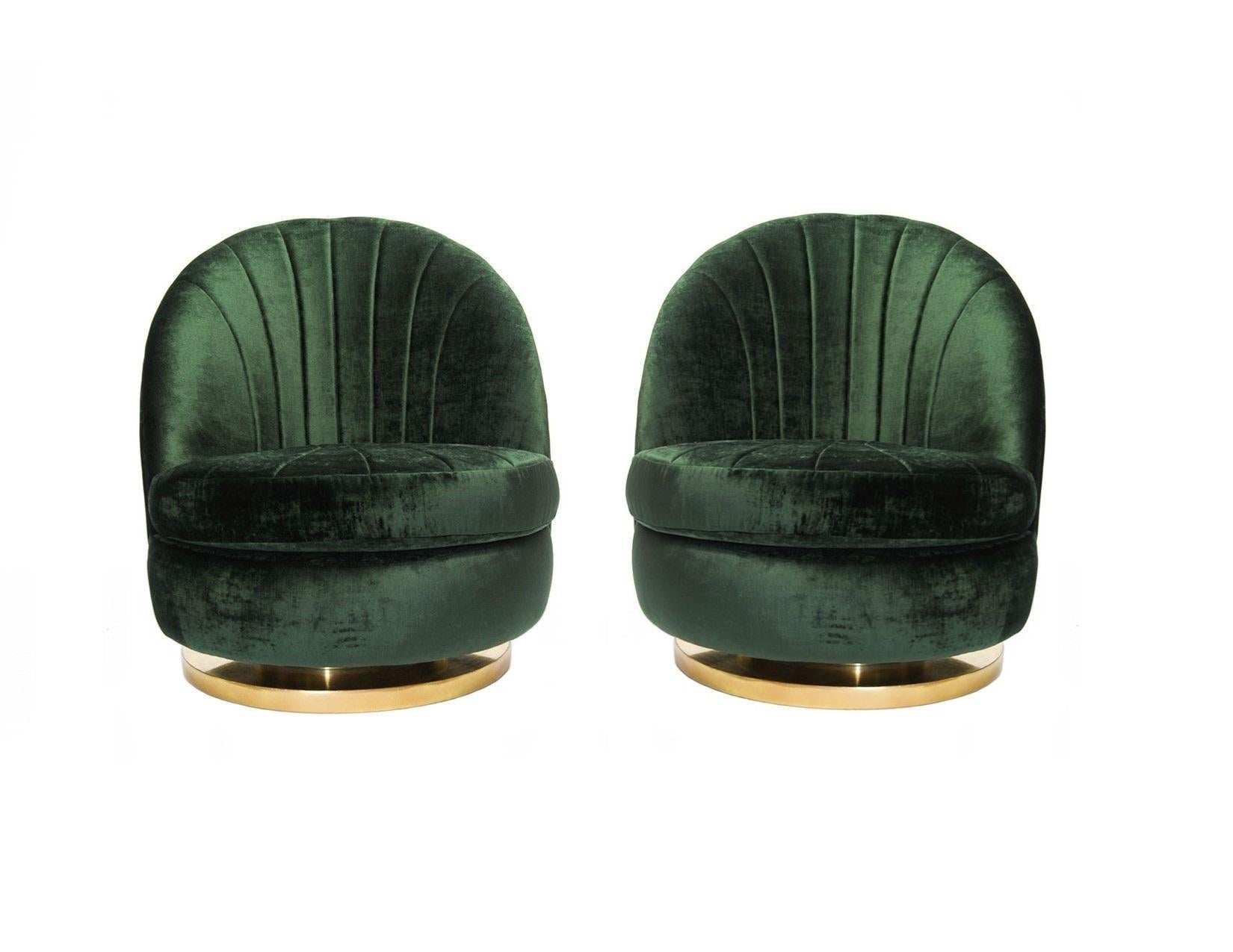 This pair of modern chairs designed by Milo Baughman for Thayer Coggin from the 1980s. These chairs are reminiscent of open scallop shells, the seats are deep and comfortable. Chairs rotate 360 degrees, tilt back and are mounted on brass bases.