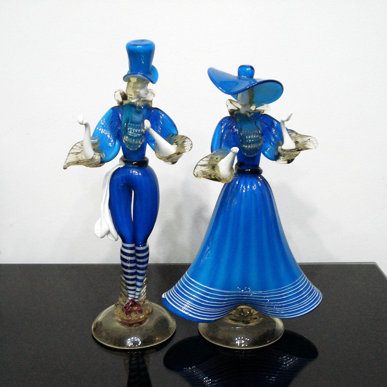 Beautiful vintage glass sculptures of a venetian couple, entirely handmade using several traditional venetian glass techniques.
A very elegant couple in a dancing posture, perfectly proportioned. Pure blue tone, detailed faces, the dance movement