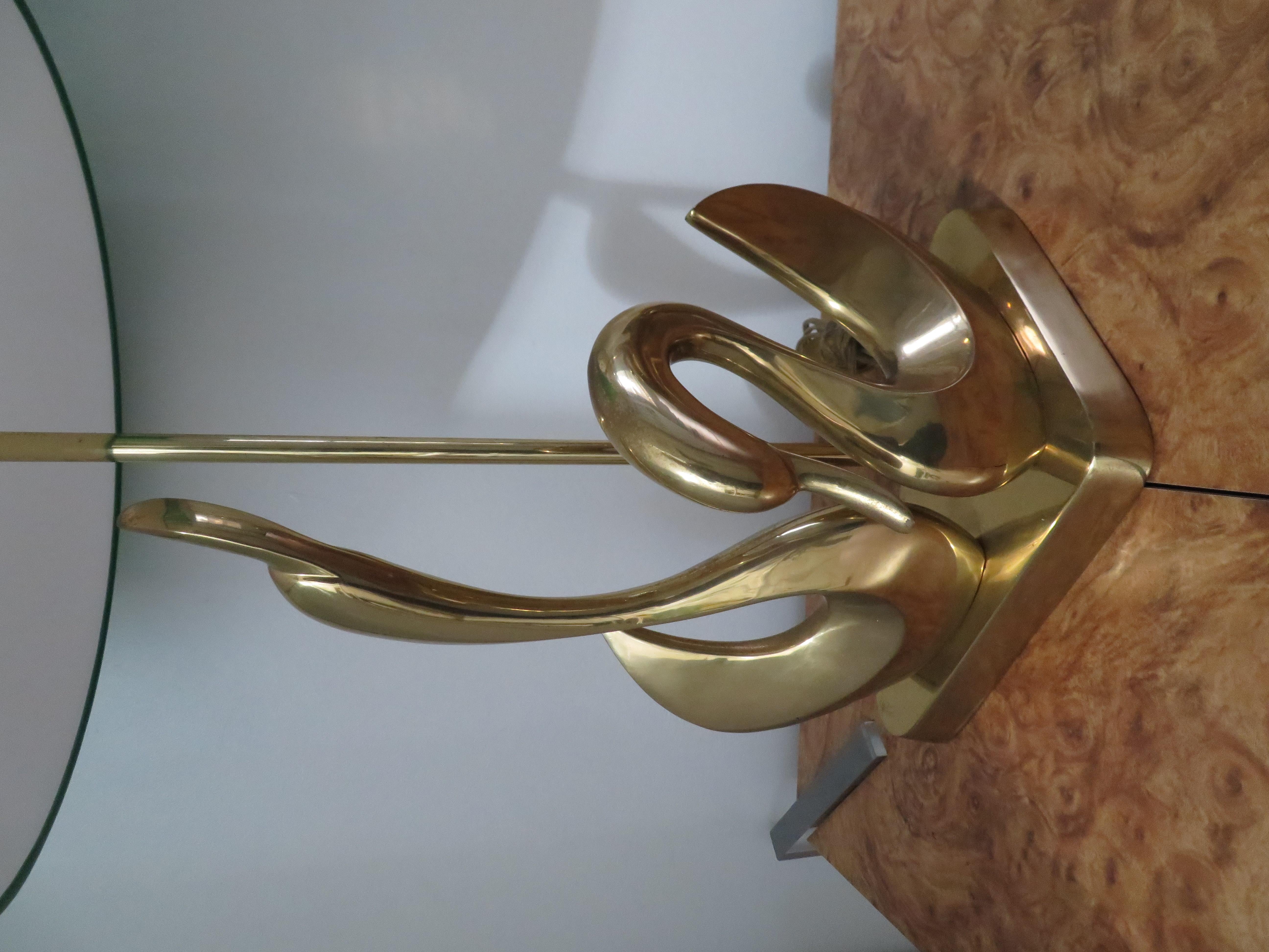 Gorgeous pair of solid brass stylized Mid-Century Modern swan lamps. I just love the mother swan with baby -wonderfully modern.