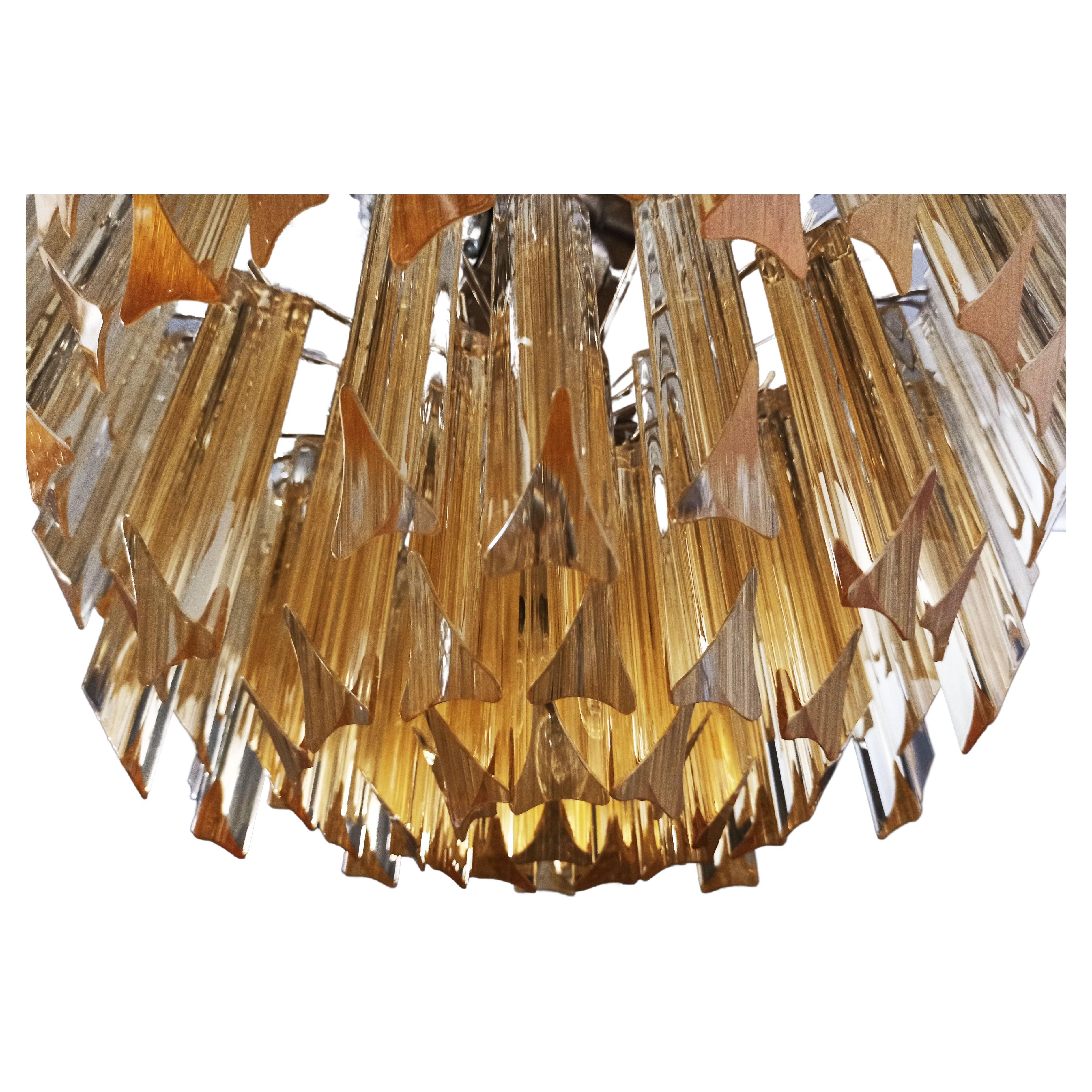 Fantastic pair vintage Murano chandeliers each made by 107 Murano crystal clear amber prism triedri in a nickel metal frame. Period: 1980'S
Dimensions: 41,90 inches height (108 cm) with chain; 17,70 inches height (45 cm) without chain; 17,70 inches
