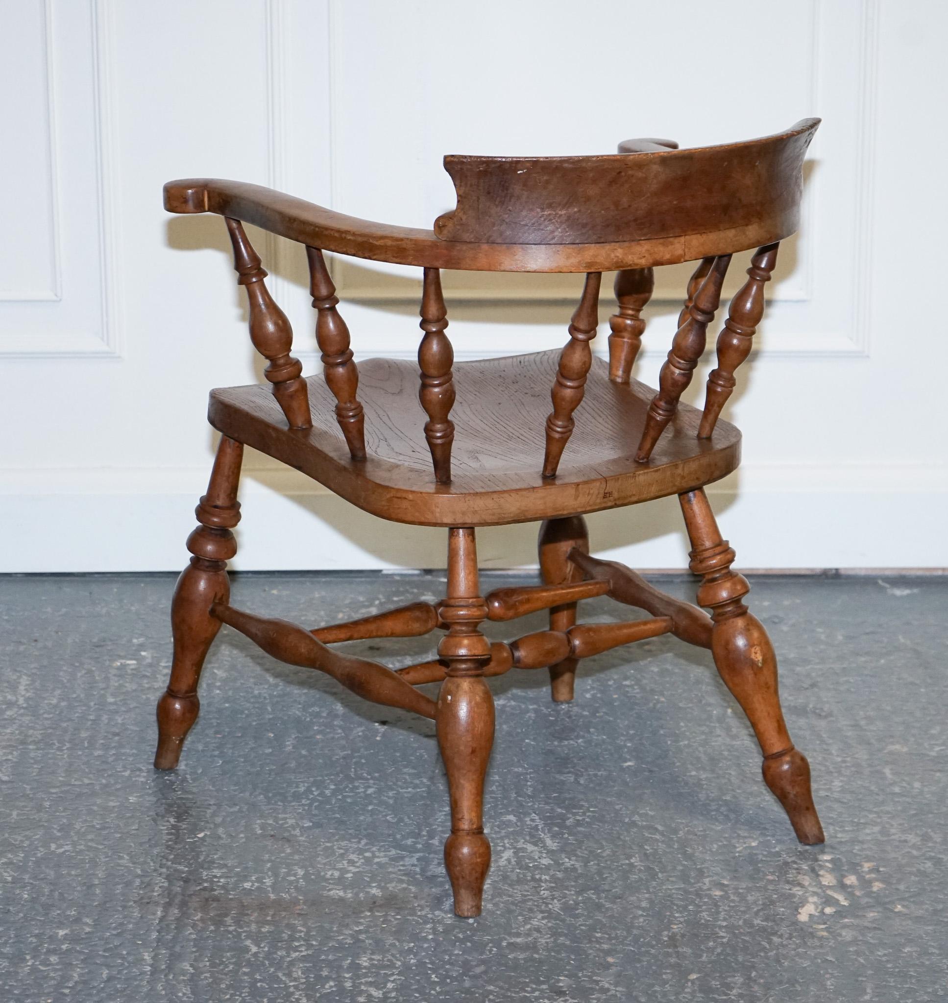 Early 20th Century Gorgeous Patina Edwardian Solid Elm Bow Back Smokers Captains Chair For Sale
