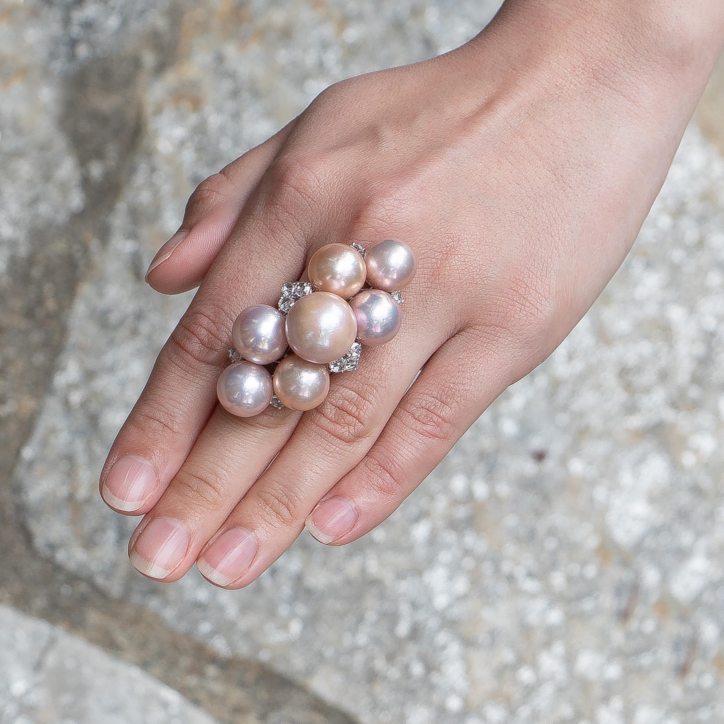 This beautiful ring is large but in a good way! It attracts the right kind of attention, and will always be the star of the show.
Pearls = 7 various sizes
Diamonds = 0.94 carats
( Color: F-G, Clarity: VS )
Ring Size = 5.75
Complimentary Ring Sizing
