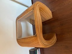 Gorgeous pencil reed end table with a glass top in the style of Gabriella CrespI