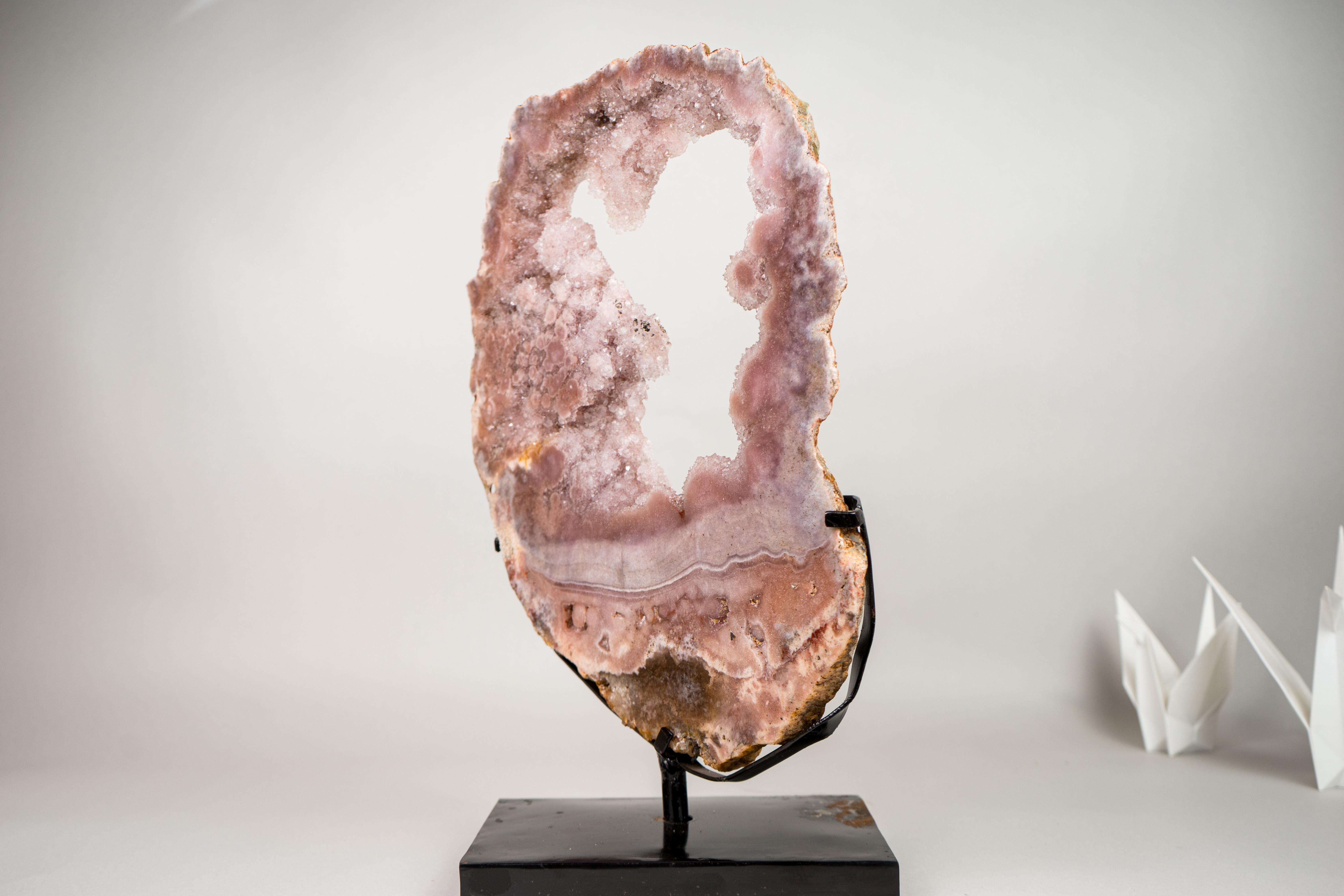 Extraordinary Pink Amethyst Geode with Rare Pink Amethyst Druzy 

▫️ Description

A specimen that turns heads with its beauty, this once-in-a-lifetime Pink Amethyst Portal offers top, world-class qualities in a rarely seen large pink tone. It’s