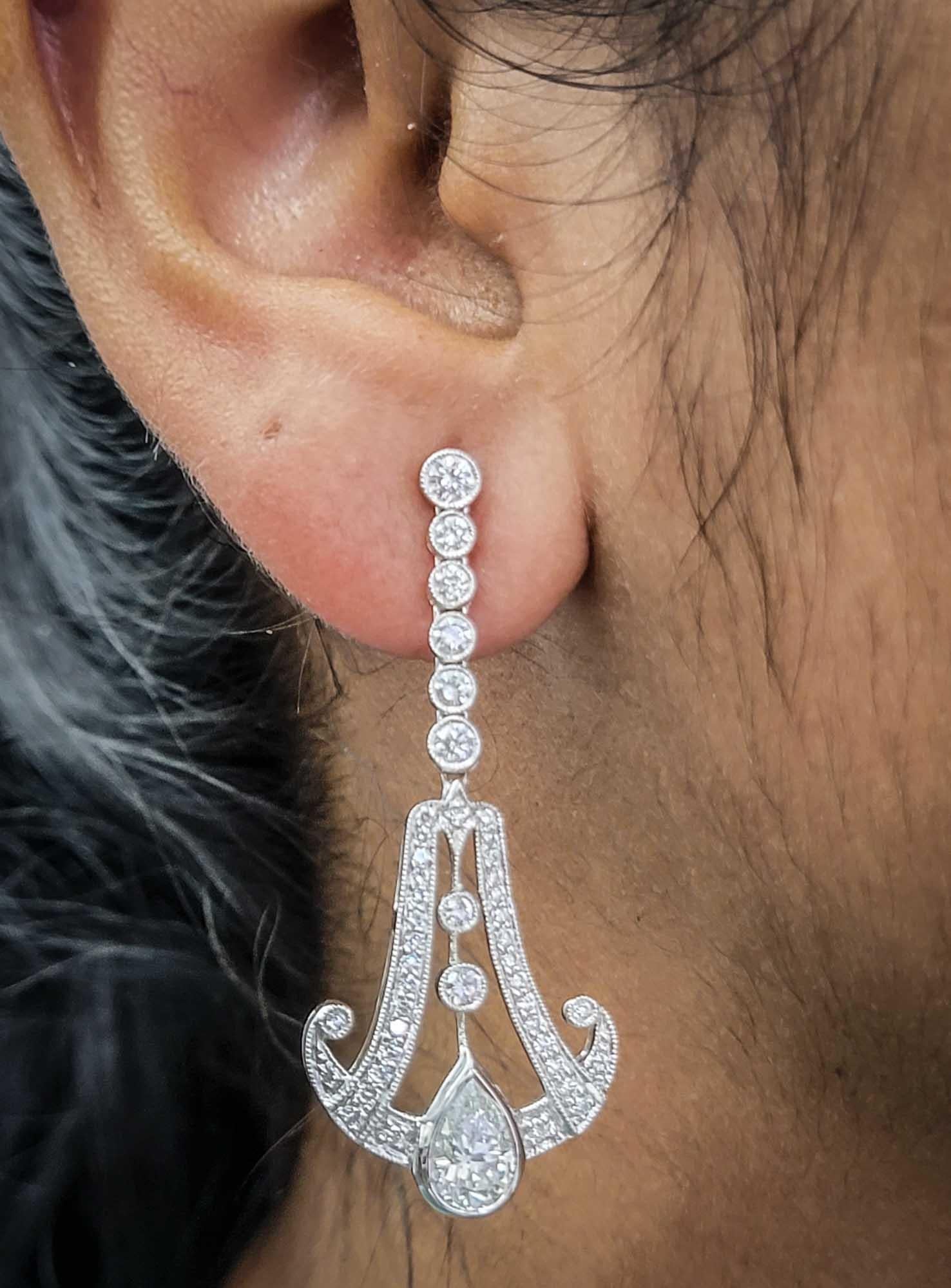 Diamond platinum earrings by Sophia D with pear cut diamonds weighing 1.44 carats and surrounding diamonds weighing 1.37 carats.

Sophia D by Joseph Dardashti LTD has been known worldwide for 35 years and are inspired by classic Art Deco design that