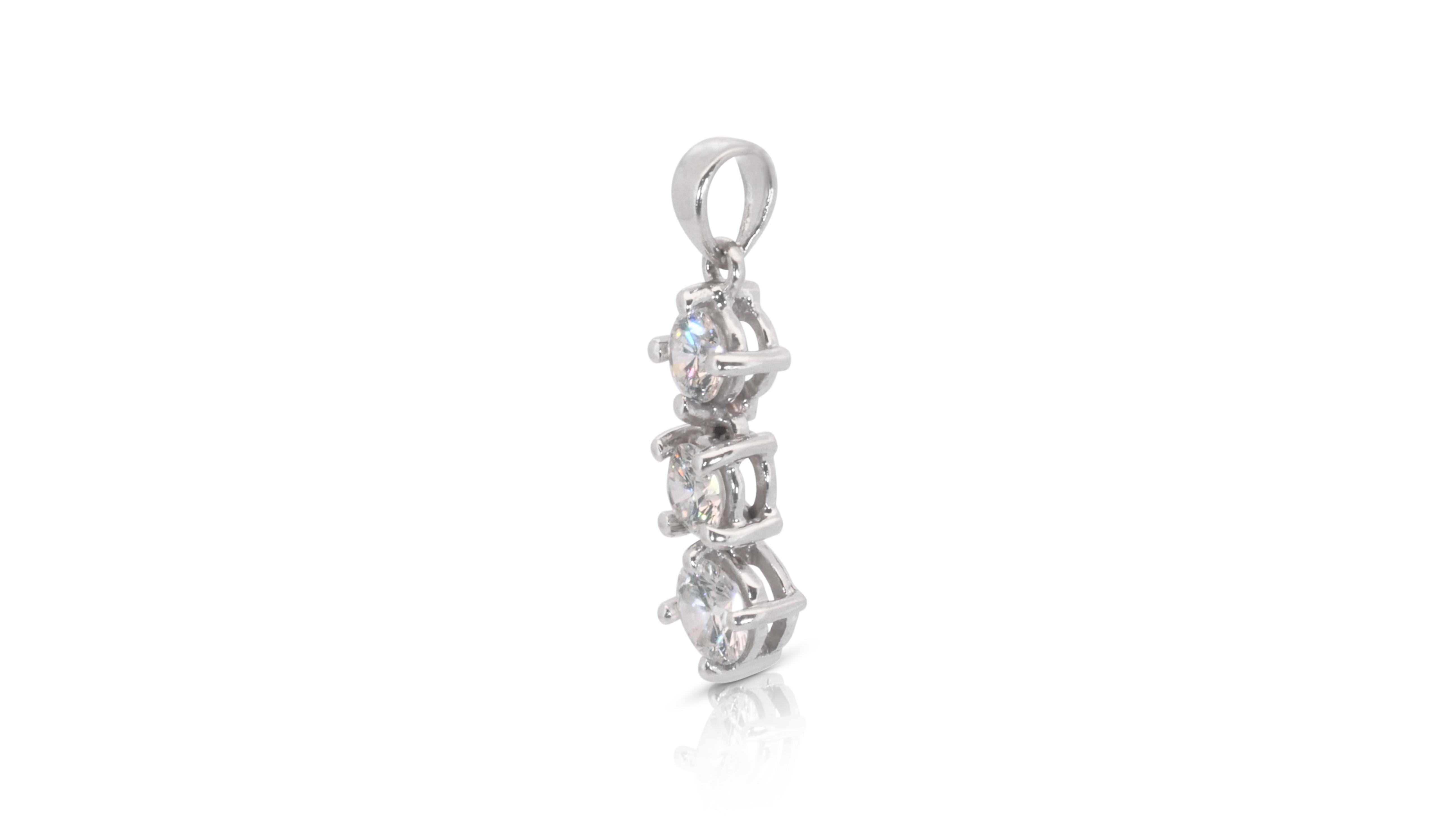 An elegant drop pendant with dazzling 0.52 carat round brilliant diamonds. The jewelry is made of platinum with a high quality polish. It comes with a fancy jewelry box. No chain is included.

3 diamonds main stone total of: 0.52 carat
cut: round