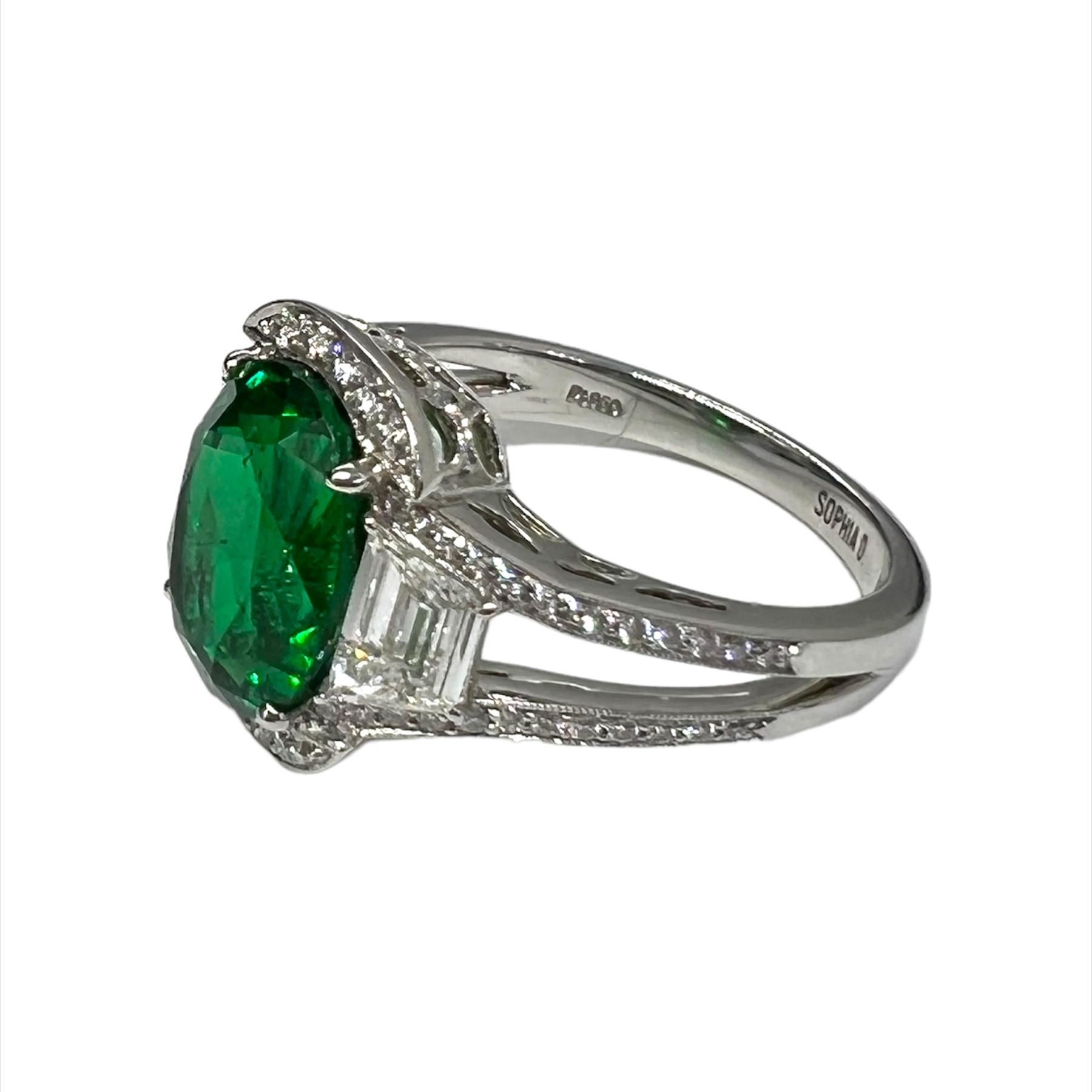 Designed and created by Sophia D., this ring in platinum setting features a round emerald that weighs 3.69 carats and is accentuated  with 0.54 carats and 0.25 carats of diamonds.  

Sophia D by Joseph Dardashti LTD has been known worldwide for 35