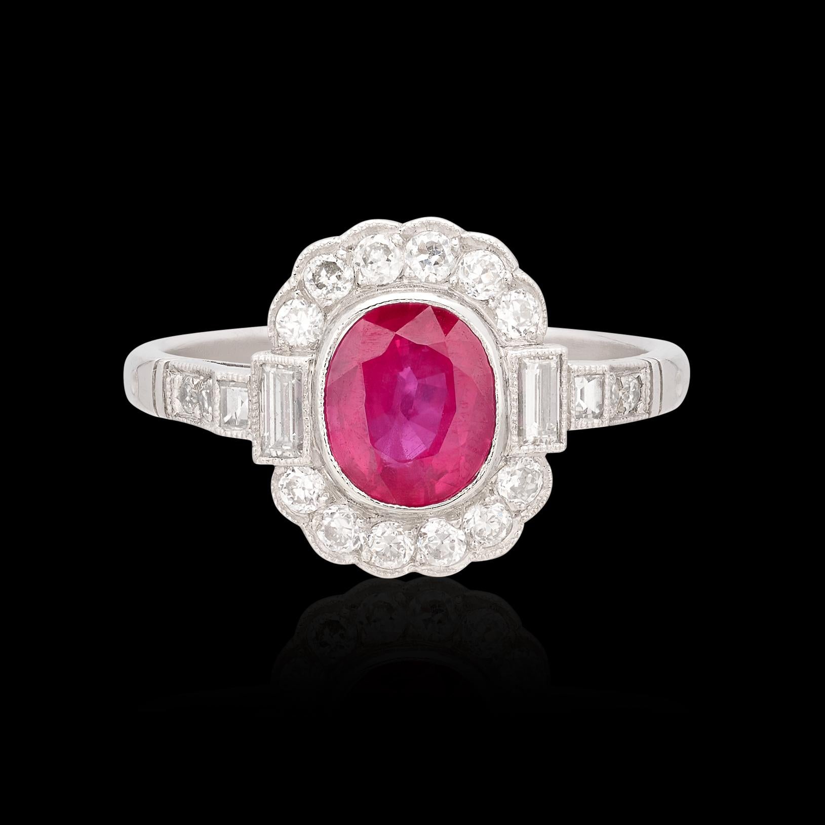 For those who appreciate the finer things! This platinum beauty features a Oval Cut Natural Ruby expertly bezel set amidst .80 carats of fine antique Old European and Baguette Cut diamonds (averaging H/VS-SI). The vibrant center ruby weighs 1.19