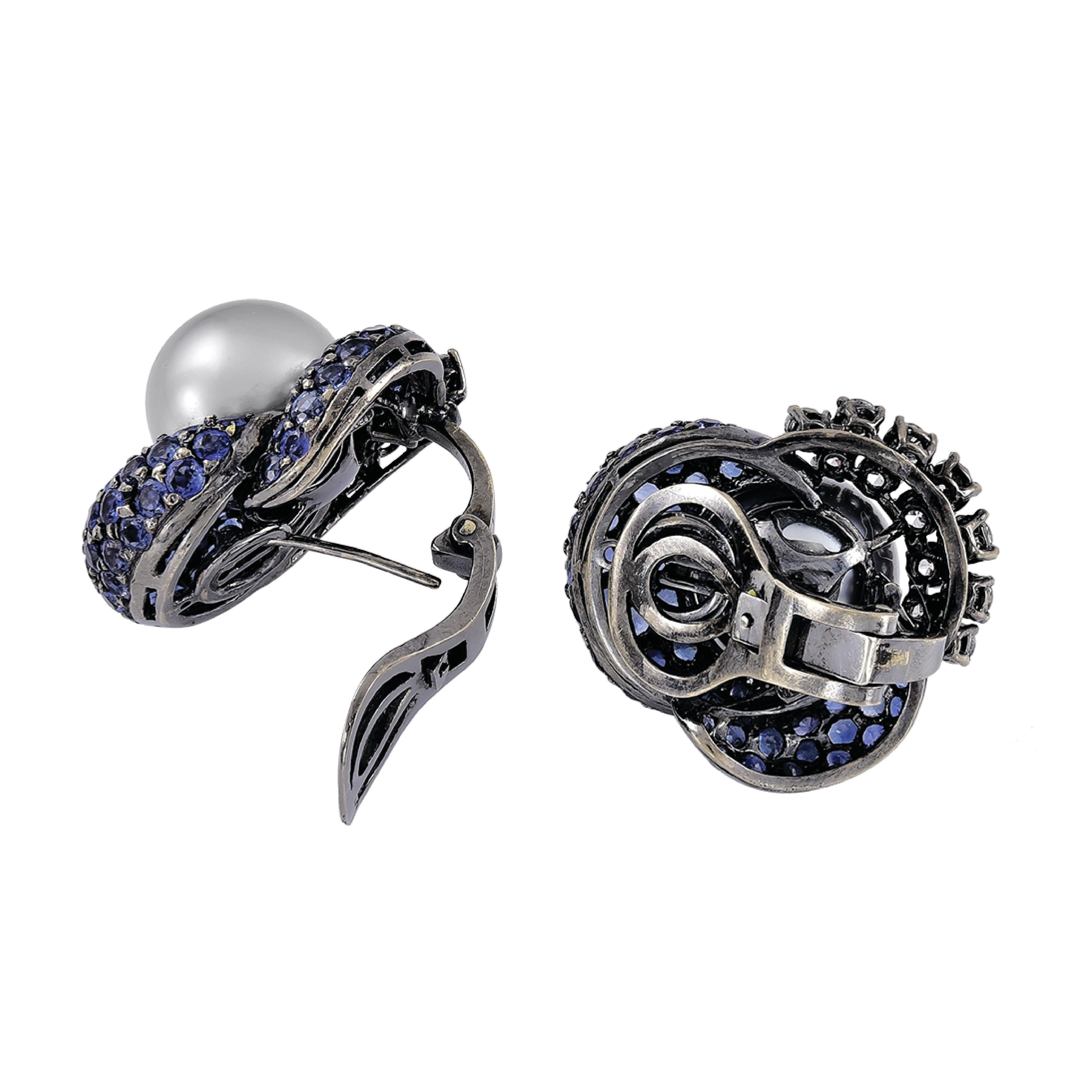 ​Pair of platinum earrings consisting of gorgeous black pearls, blue sapphires weighing 7.48 carats and diamonds weighing 1.80 carats.

Sophia D by Joseph Dardashti LTD has been known worldwide for 35 years and are inspired by classic Art Deco