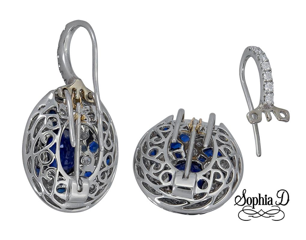 Art Deco style platinum earrings made and designed by Sophia D that features a blue sapphire center weighing 3.30 carats with surrounding sapphires weighing 5.88 carats and diamonds weighing 1.36 carats.

Sophia D by Joseph Dardashti LTD has been