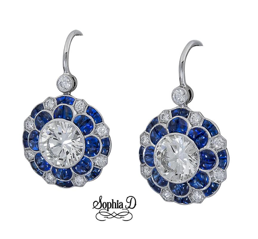 Sophia D's gorgeous blue sapphire and diamond earrings with center diamonds weighing 1.08/1.11 carats with surrounding sapphires weighing 2.20 carats and diamonds weighing 0.26 carats.

Sophia D by Joseph Dardashti LTD has been known worldwide for