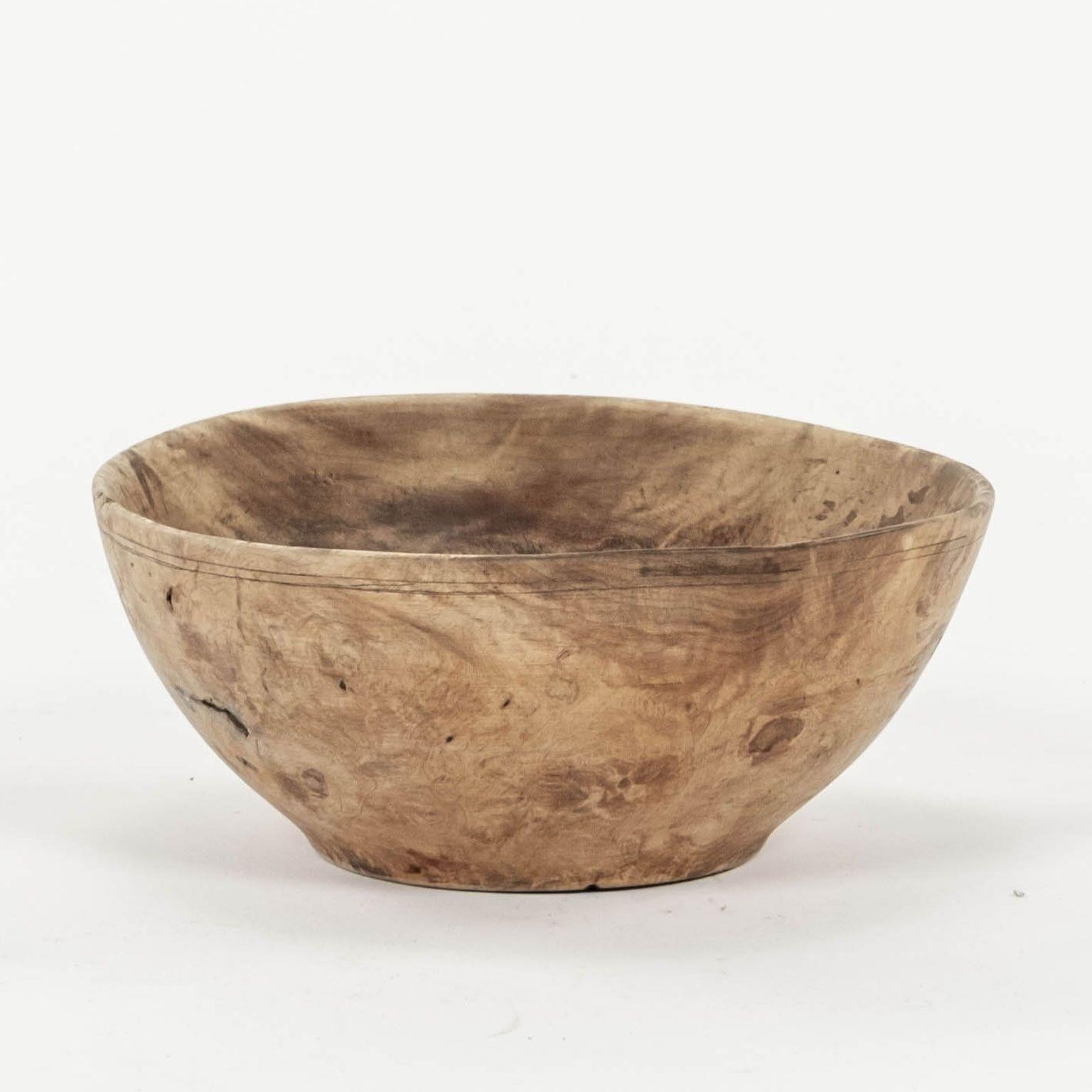 Gorgeous primitive Swedish burl rootwood bowl dating to the early 19th century. Beautifully organic burl wood grain patterns decorate surface of this bowl. Two old steel plug repairs enhance the bowl's charm and character.

Note: Original/early