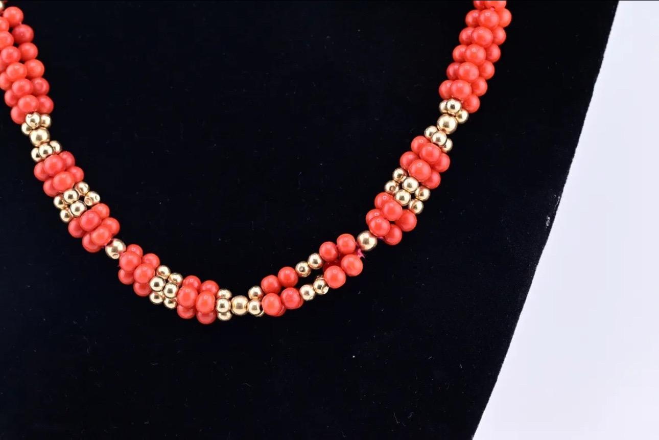 This stunning necklace features beautiful red blood coral beads that shimmer in the light. The natural, untreated coral gives each bead a unique texture and color, making it a truly one-of-a-kind piece. The beads are strung together in a beaded