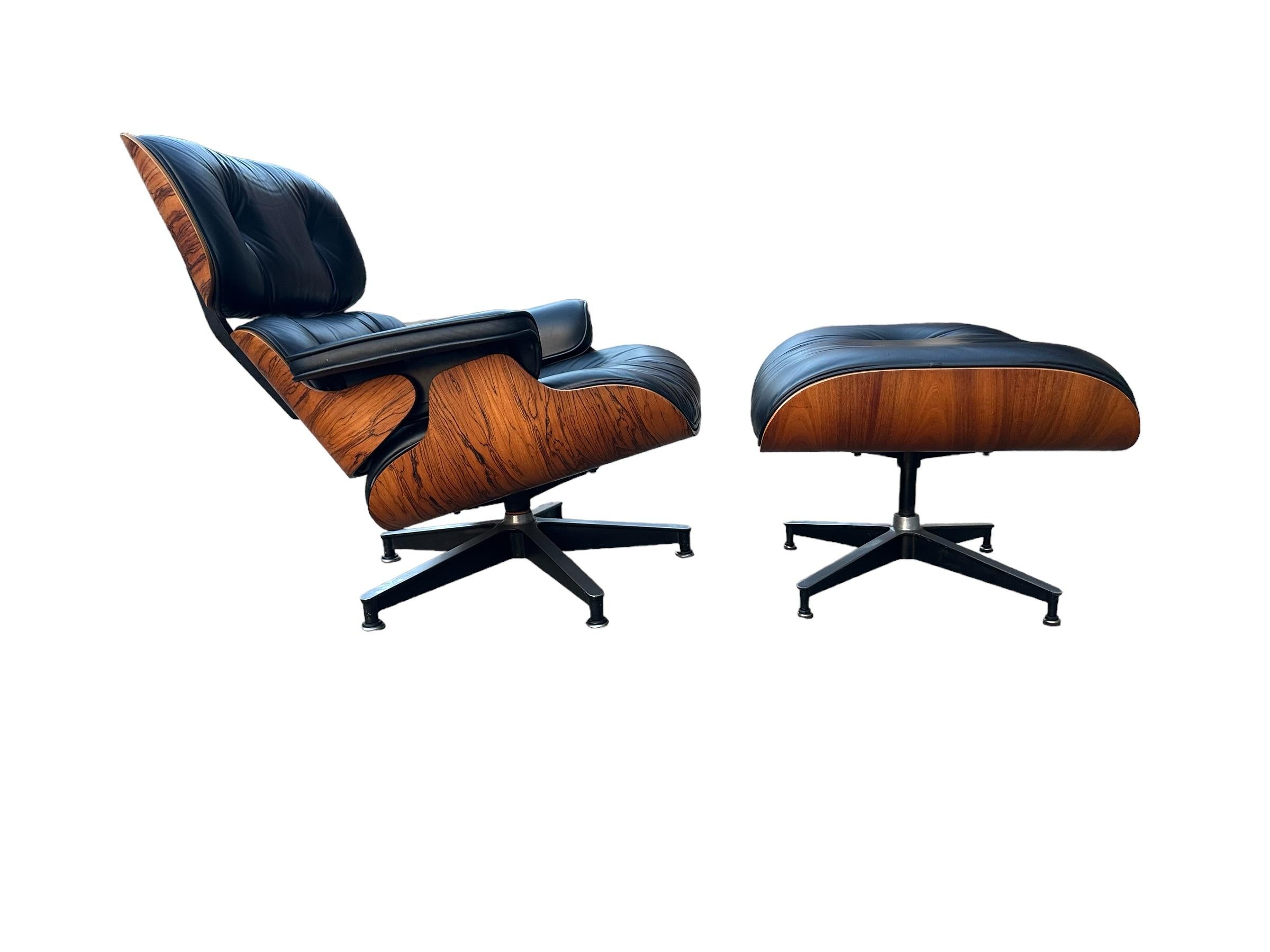 Iconic vintage Herman Miller Eames lounge chair and ottoman. Featuring lustrous refinished Brazilian rose wood, boasting beautiful color and grain pattern. Black leather cushions in great shape. Even color and finish. No missing buttons. Chair and