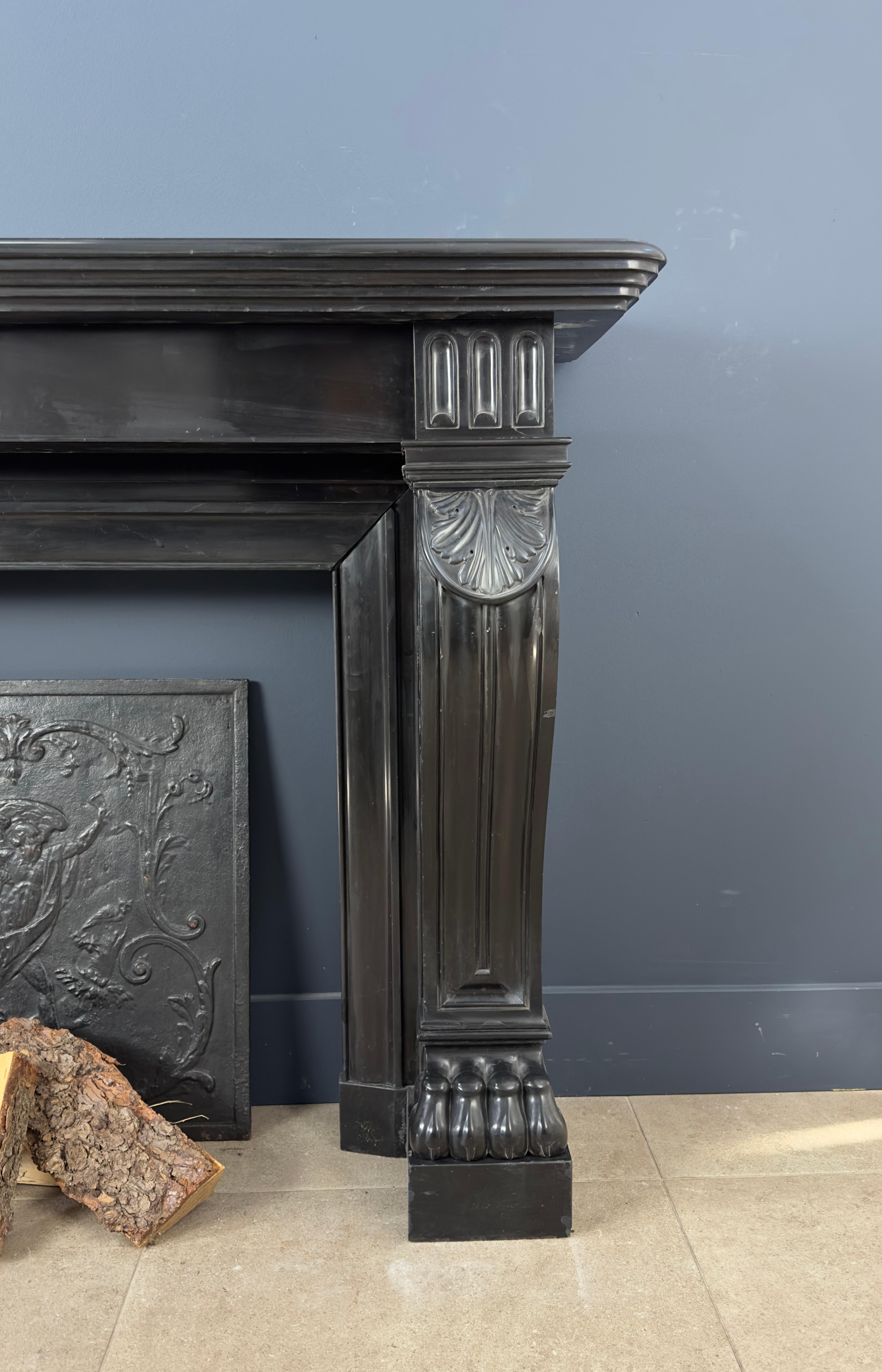 

Exceptionally beautiful and powerfully decorated antique front fireplace crafted from the exquisite Noir de Mazy black marble. Every aspect of this fireplace exudes luxury and elegance, making it an unmistakable centerpiece in any room.

Be