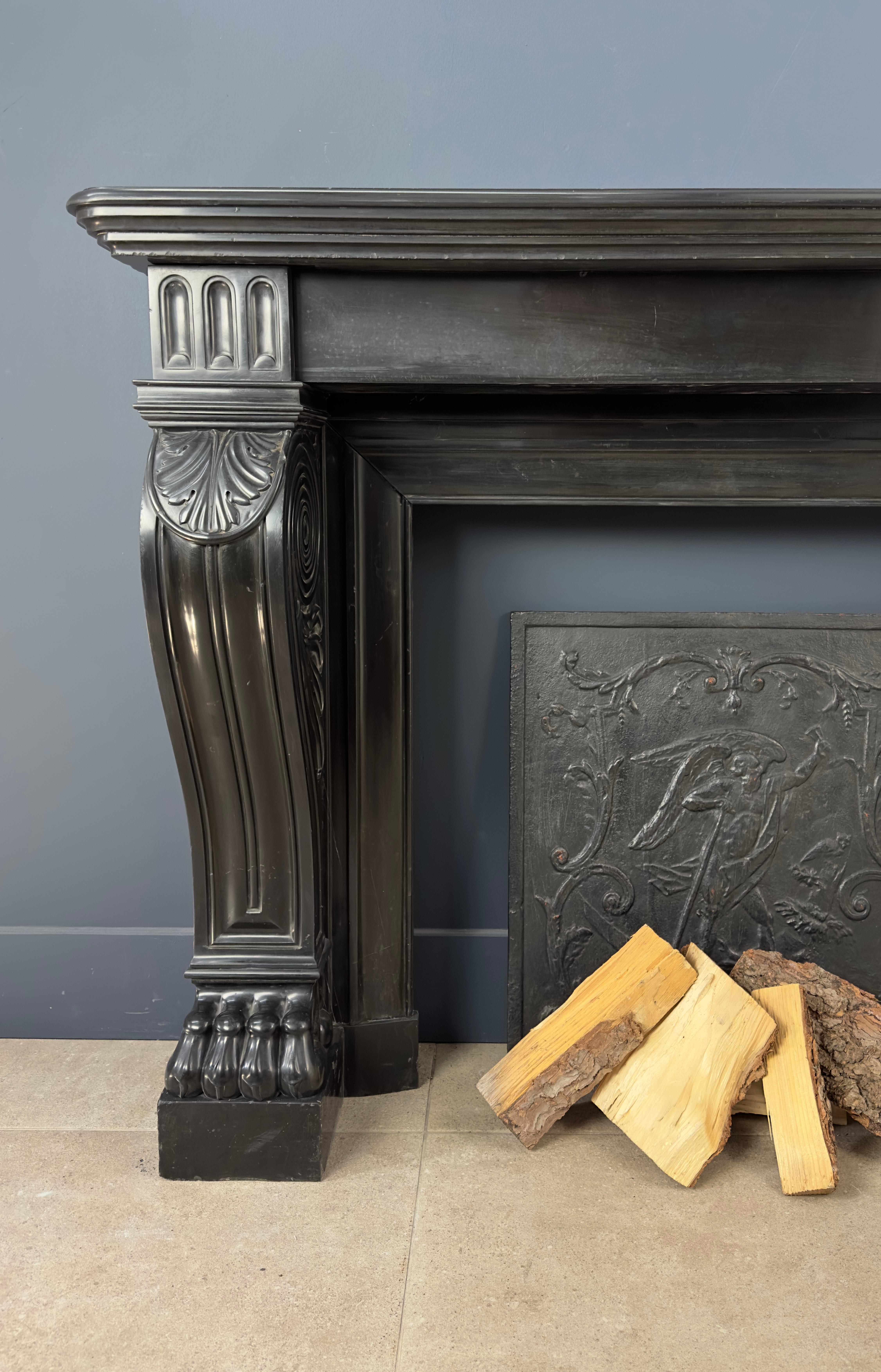 Belgian Gorgeous Richly Decorated Front Fireplace Surround in Noir De Mazy Black Marble For Sale