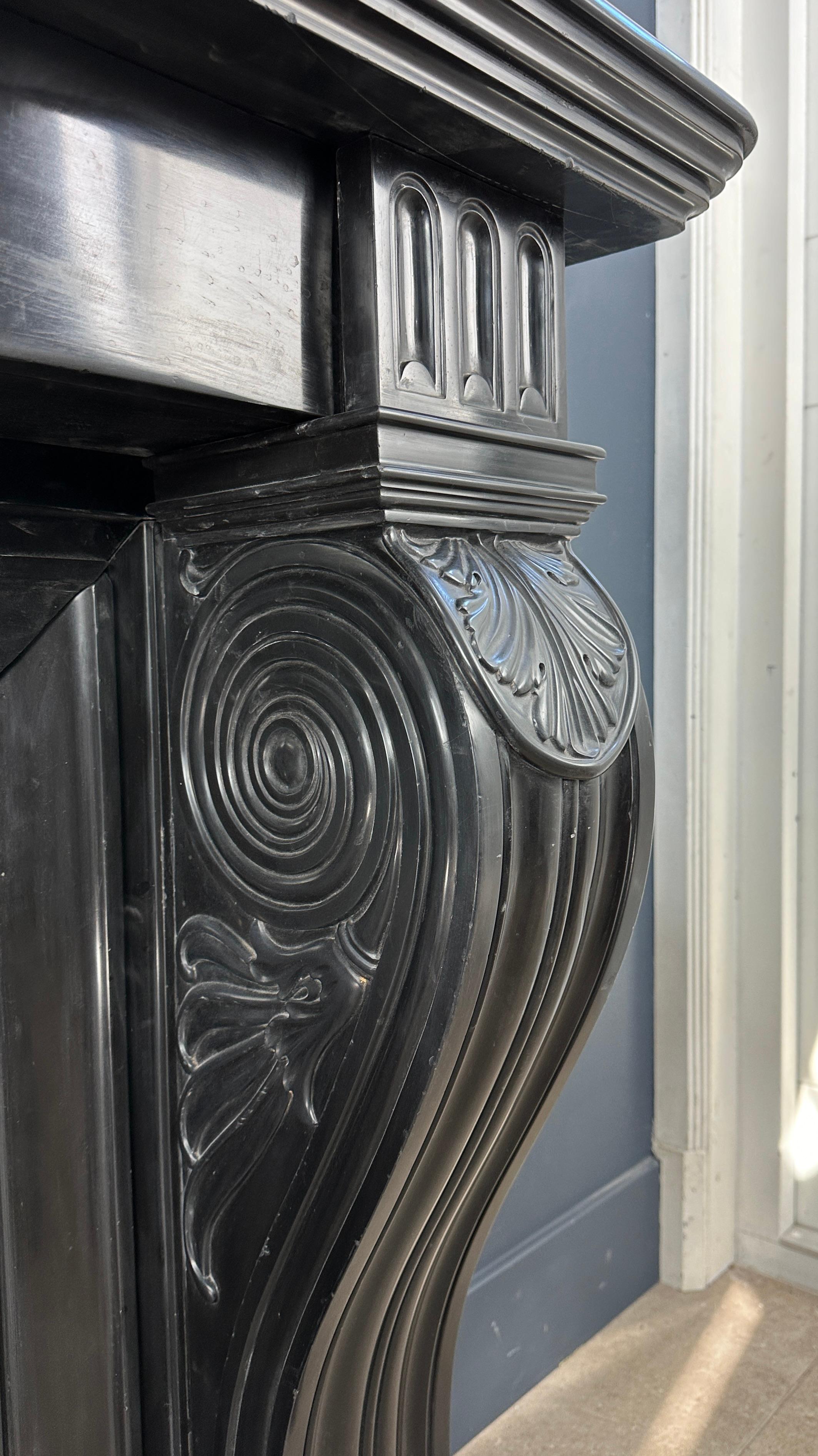 Hand-Carved Gorgeous Richly Decorated Front Fireplace Surround in Noir De Mazy Black Marble For Sale