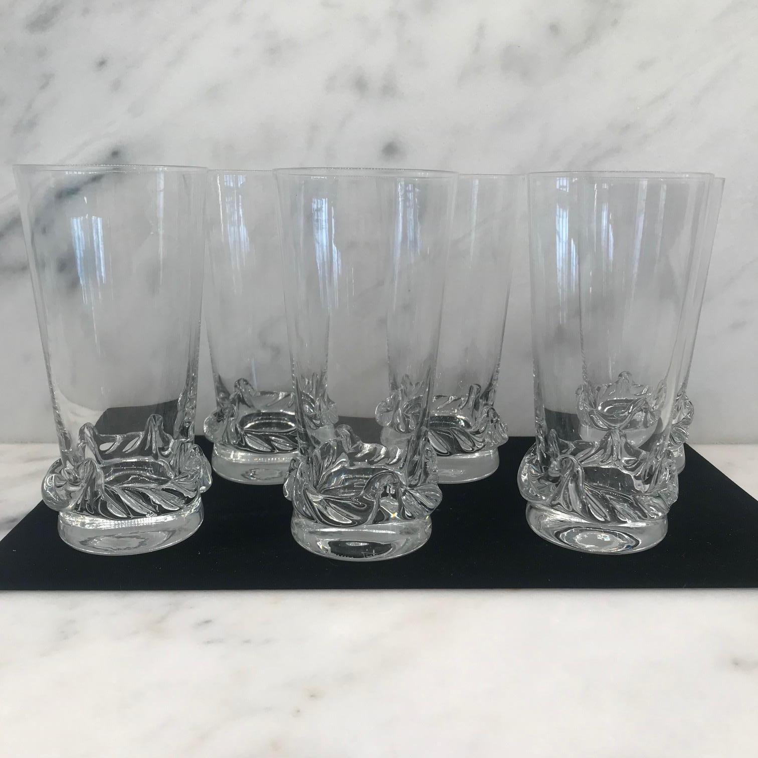 A sculptural clear art glass set of 6 glasses made by Daum, one of the most famous French glass makers of the period circa 1950. With its timeless form and clean modernist lines, these glasses blend seamlessly with any style of interior from