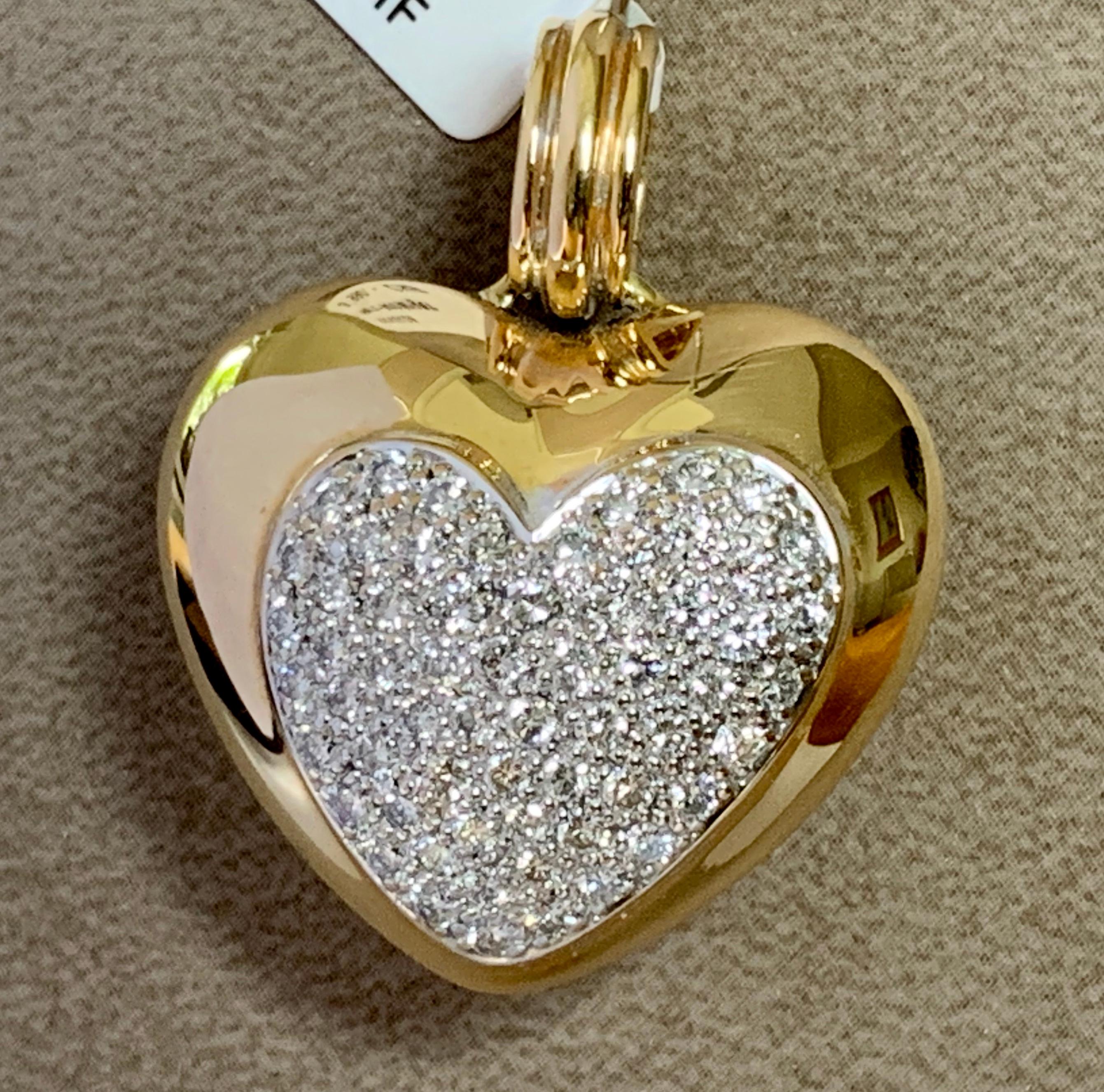 Gorgeous Diamond Heart Pendant featuring 60 round Diamonds in Pave Setting with a total weight of 2.10 ct, G color, vs clarity. In 18 K white and yellow Gold. 
Size of Heart = 30 mm Wide x 38 mm Long
19.26 grams. 