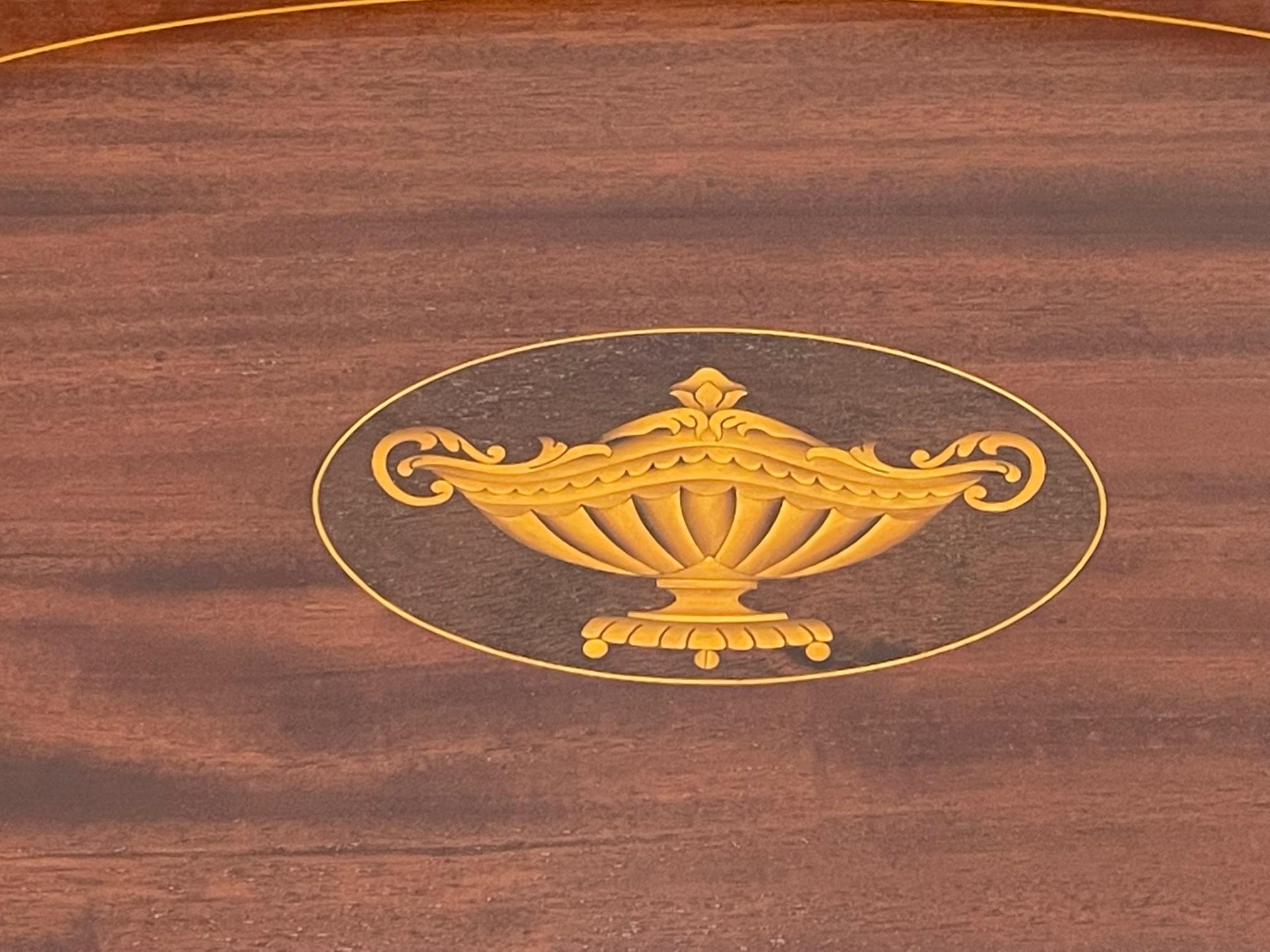 Very handsome sterling silver mounted mahogany gallery tray with neoclassical satinwood inlaid urn decoration. Signed as shown in photo.
Measures: 2