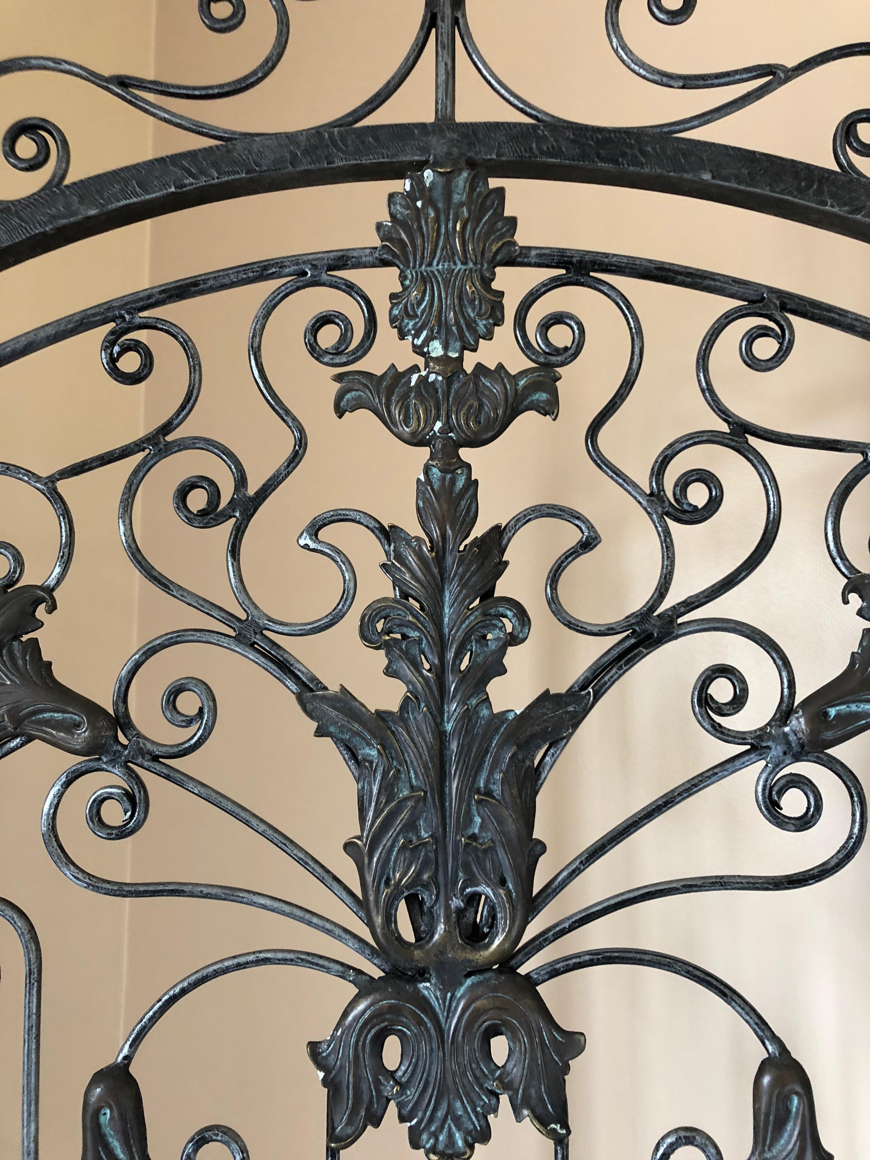 Stunning 2-panel painted iron screen in silvery black with ornate bronze mounts. Each panel is 26.25 W
Doesn't open completely flat, so not meant to be hung on a wall.