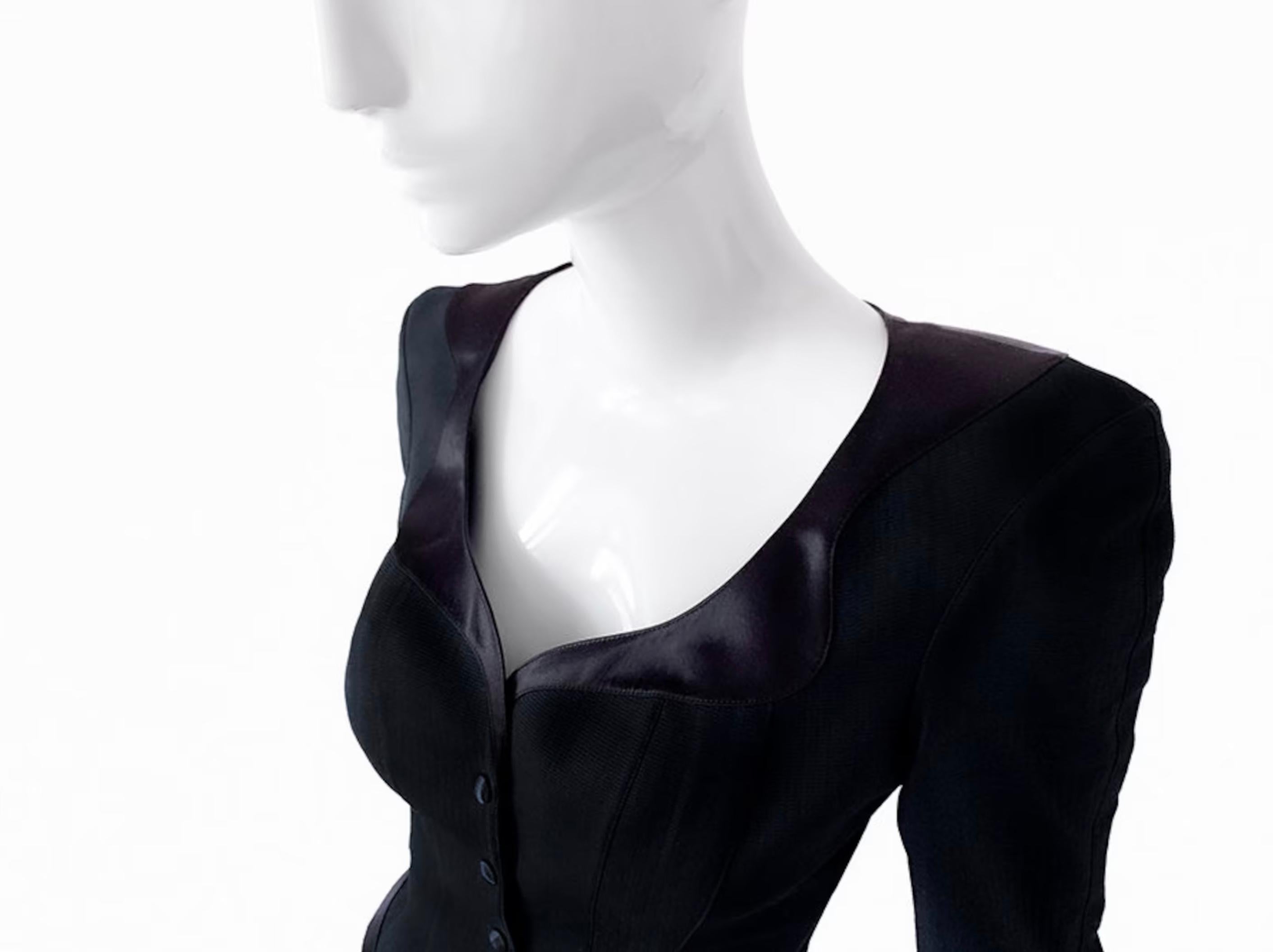 
Beautiful rare vintage Thierry Mugler skirtszut, Bassuming FW 1992 Collection. Two piece ensemble: Jacket and Skirt. Black jacket top with shimmering silky satin details on collar, cuffs, waist and hem. Amazing construction, the shape is so