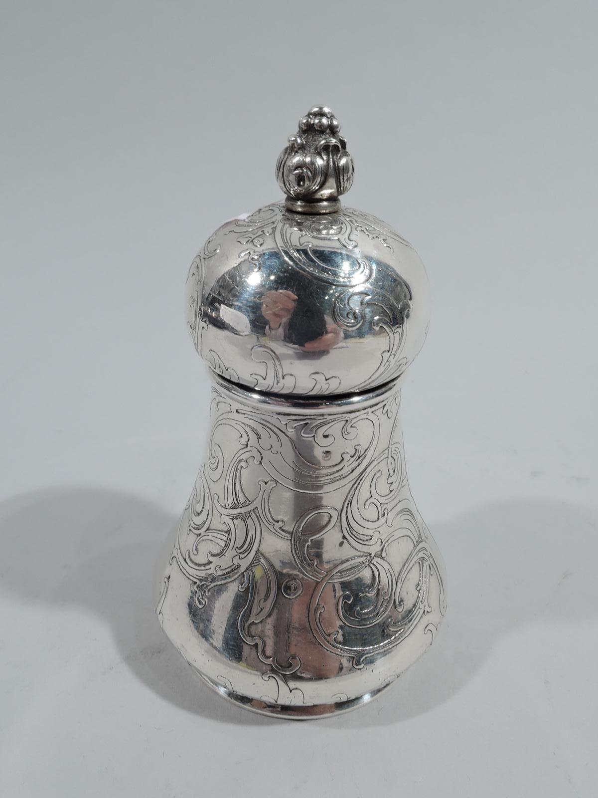 Gorgeous Art Nouveau sterling silver pepper mill. Made by Tiffany & Co. in New York. Round with spread base and round and rotating cover with bud finial. Acid-etched ornament with loose scrolls entwined in stylistically integrated monogram. Fully