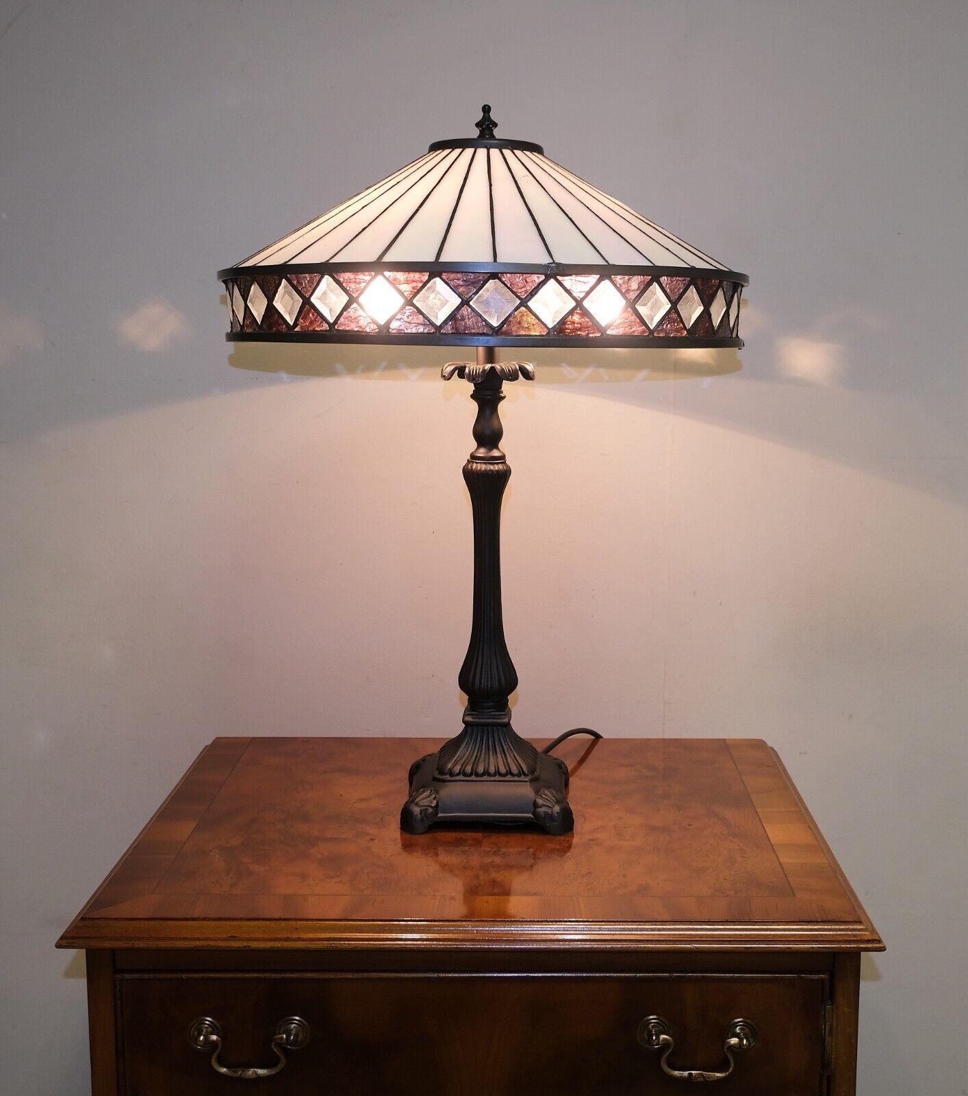 We are delighted to offer for sale this lovely Fargo Tiffany style art deco medium table lamp on bronze stand. 

This stylish, well  made and lovely table lamp features clean lines, subtle colour and uniform symmetry at the top of the shade, along