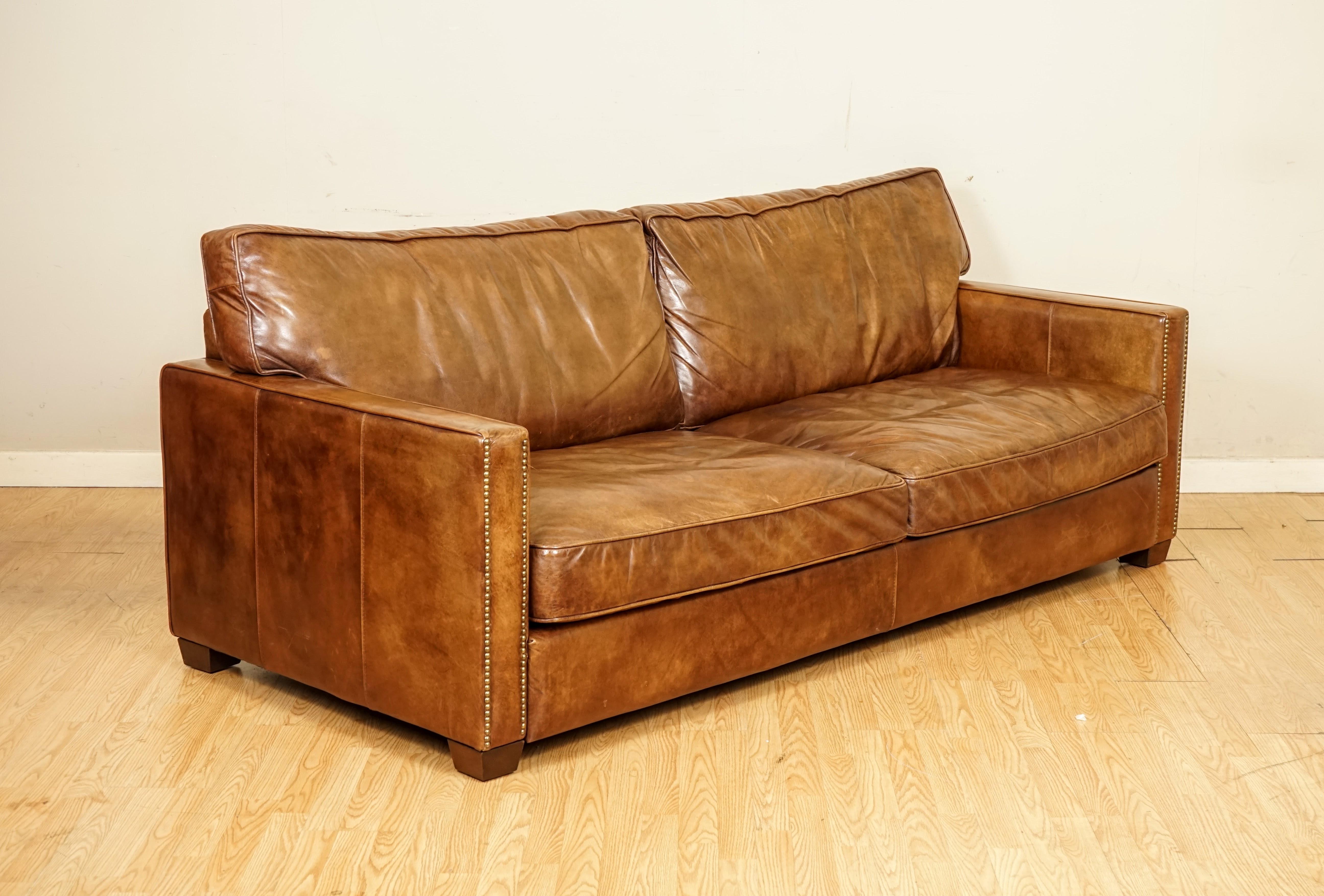 We are so excited to present to you this Gorgeous Timothy Oulton Viscount brown leather sofa.

The Viscount William range is a true Timothy Oulton Classic, looking comfortably at home everywhere from modern loft apartments to more traditionally