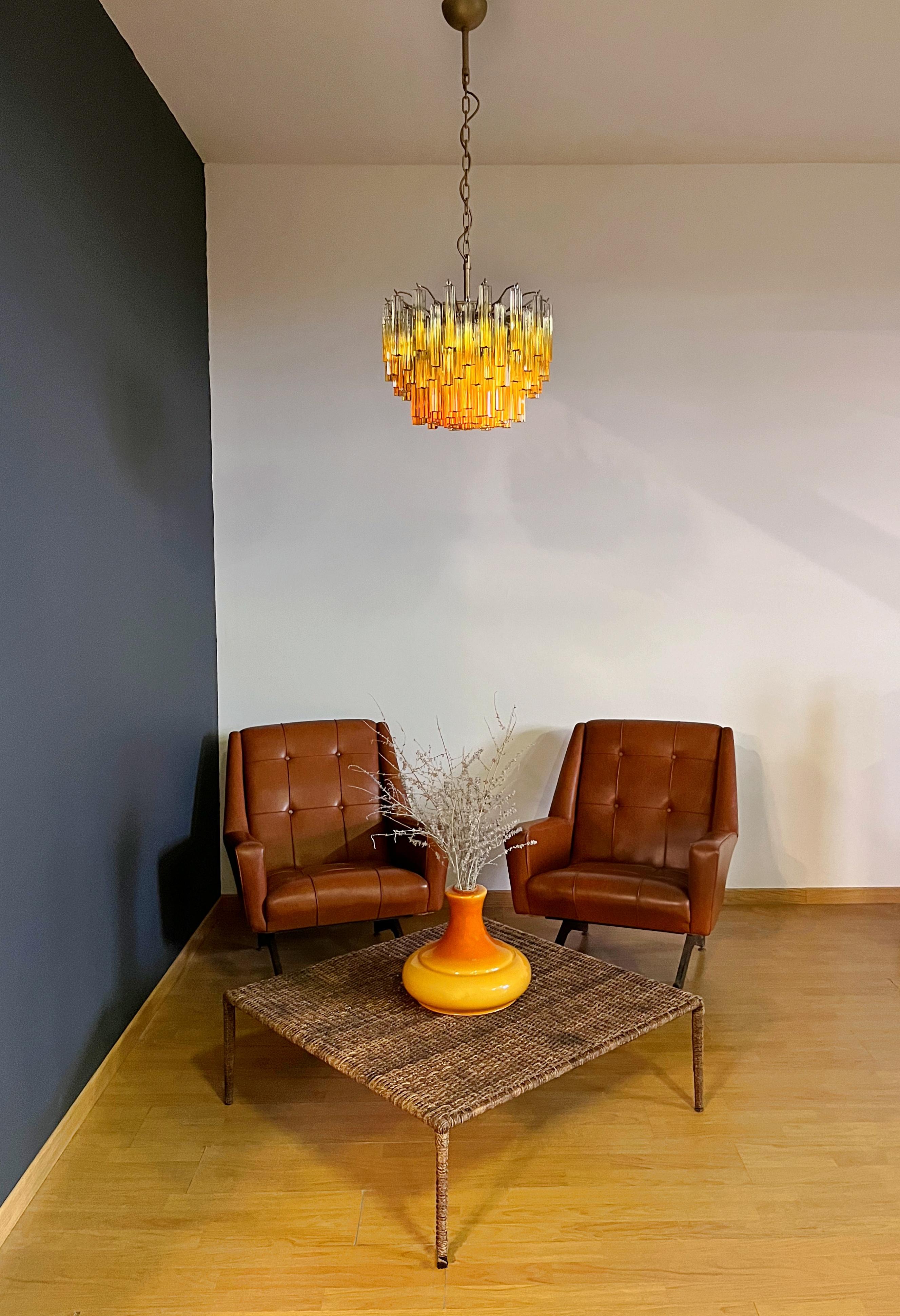 Fantastic vintage chandelier made by 107 Murano crystal prism quadriedri in a painted gold metal frame. The glasses: quadriedri transparent shaded amber
Period: late XX century 
Dimensions: 45,25 inches height (115 cm) with chain; 15,75 inches